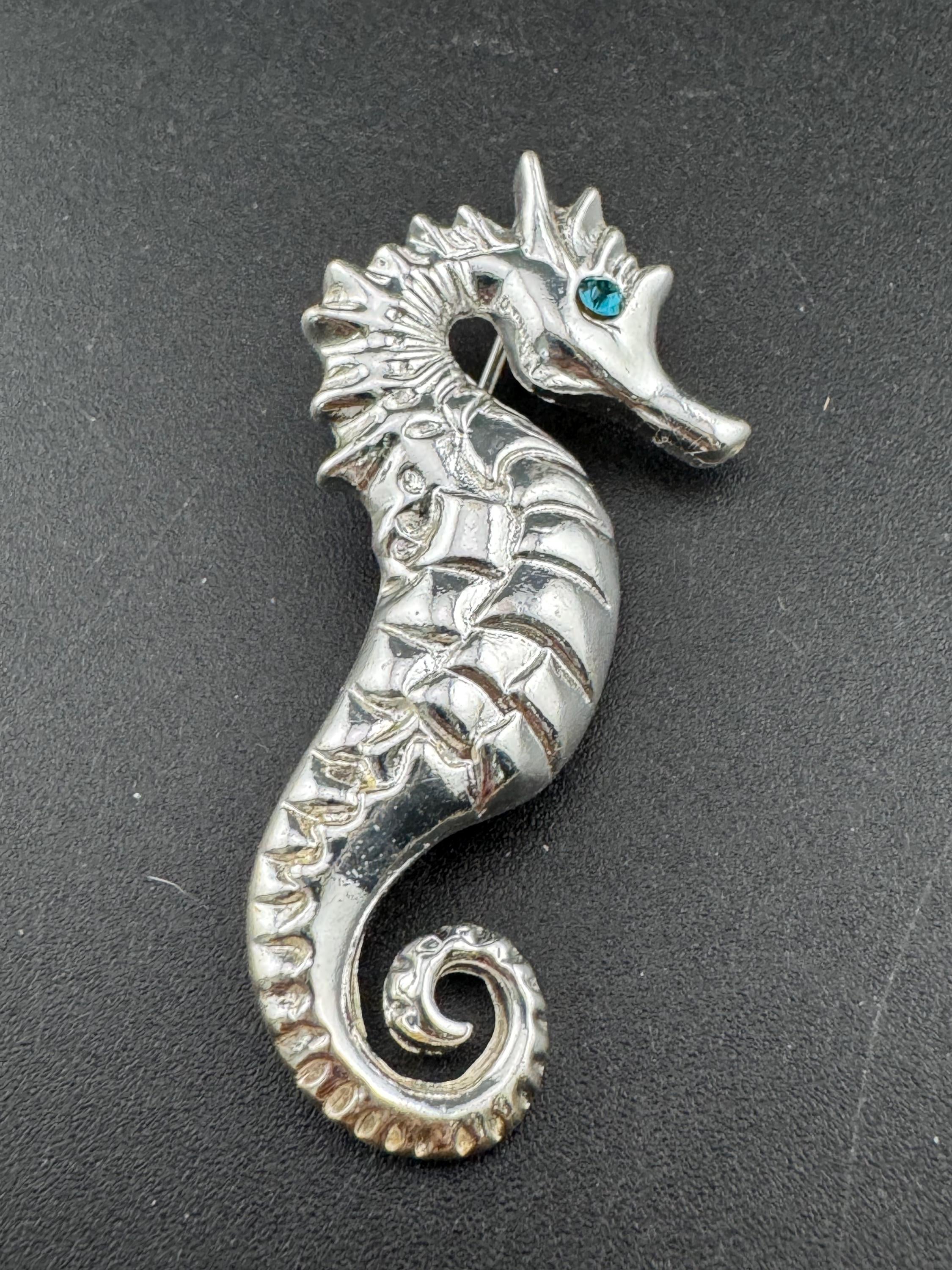 Vintage silver metal seahorse brooch with turquoise blue diamanté eye, nautical marine style