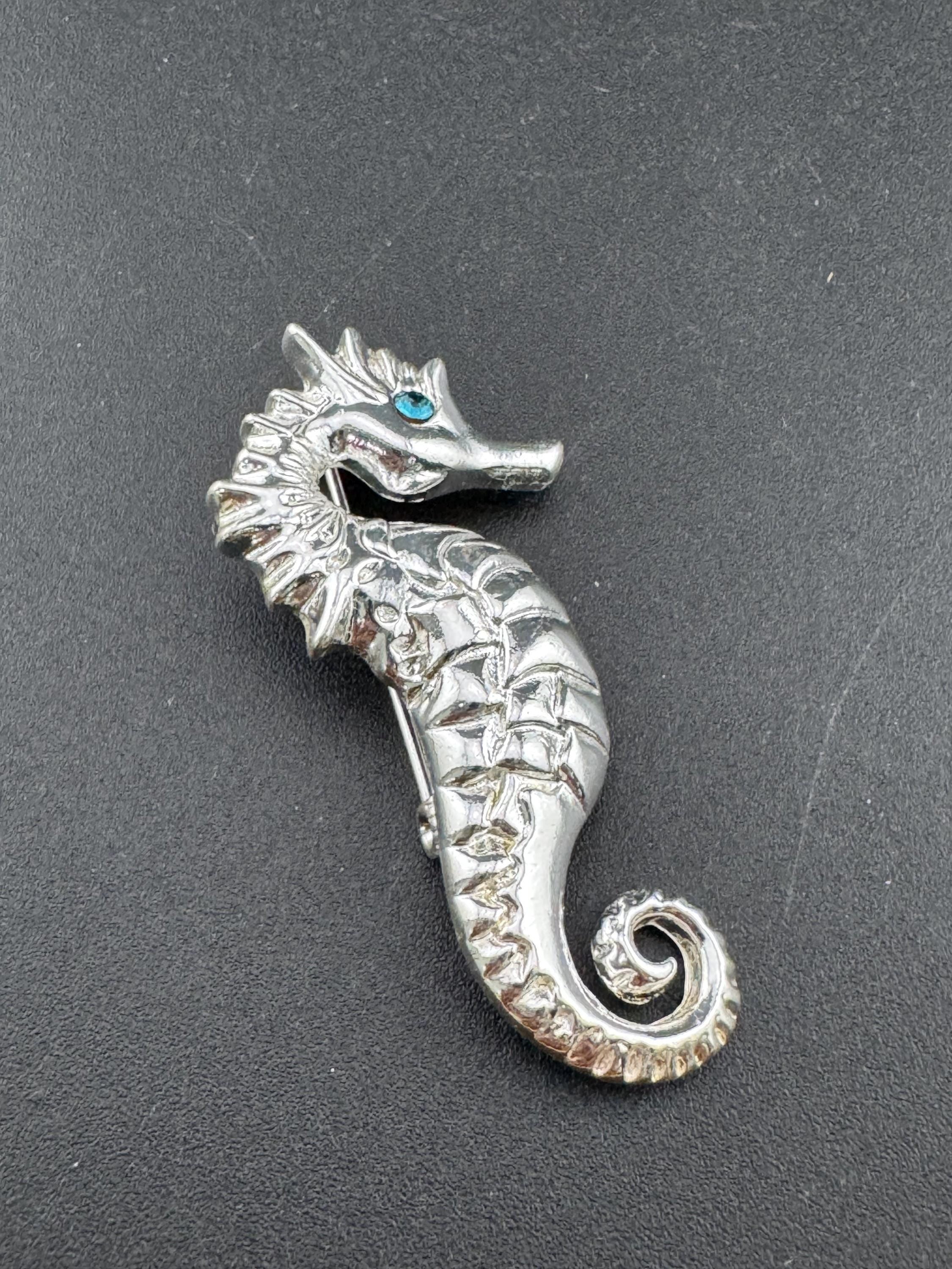 Vintage silver metal seahorse brooch with turquoise blue diamanté eye, nautical marine style