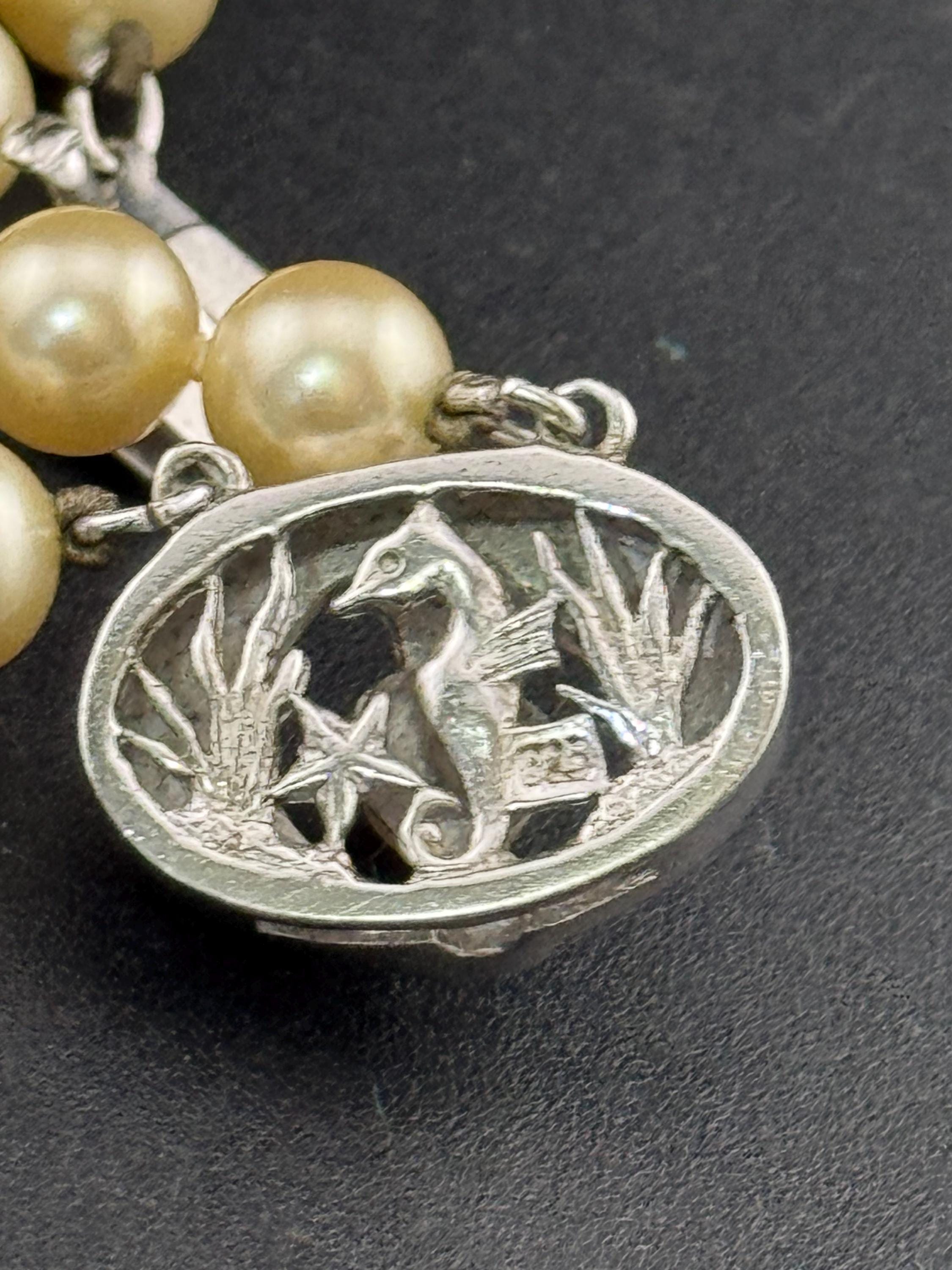 Vintage Sterling 925 Silver knotted faux pearl double row bracelet with ornate clasp with seahorse and starfish logo on