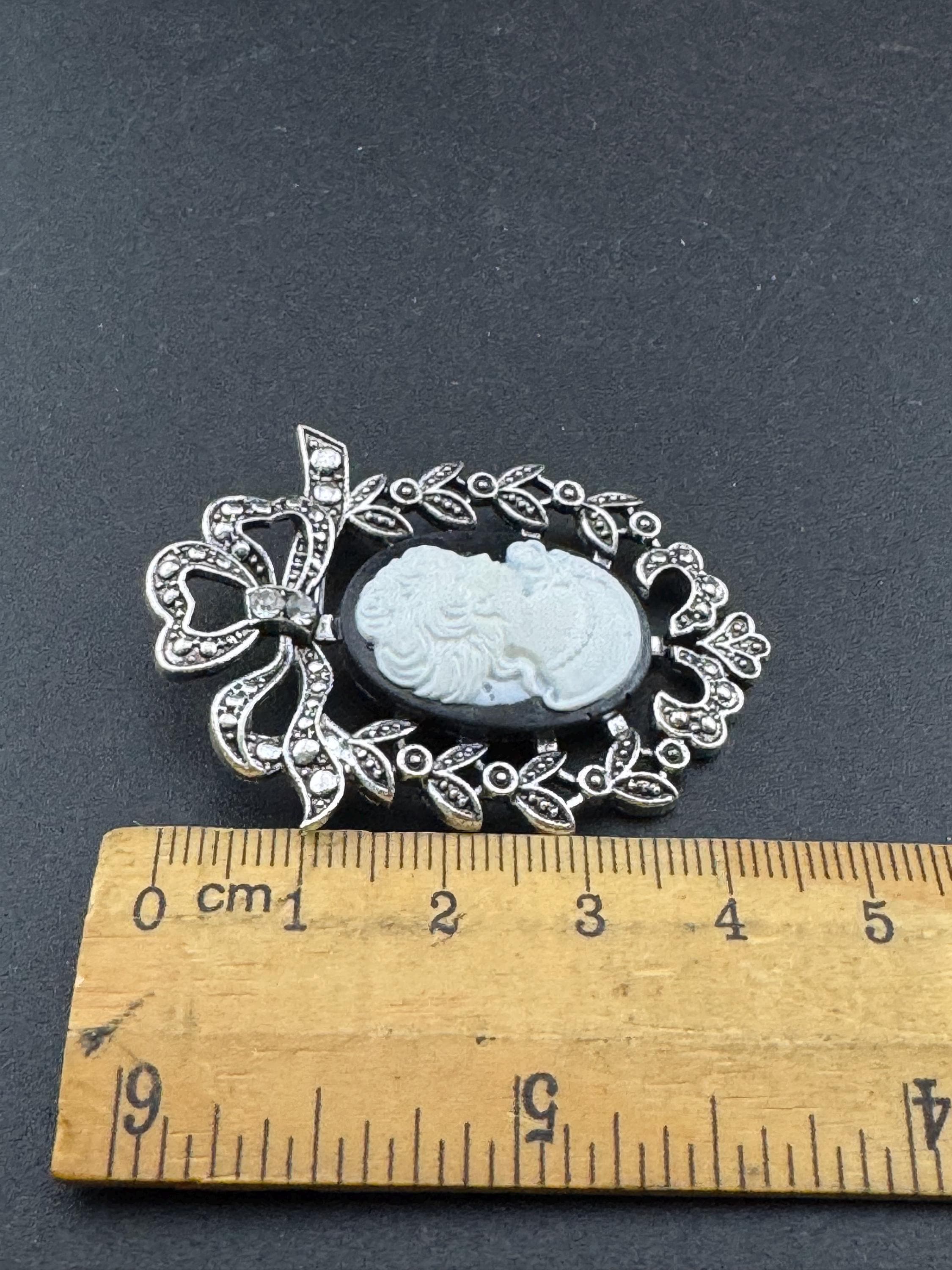Vintage style handmade black and white cameo brooch with antique silver tone ornate frame
