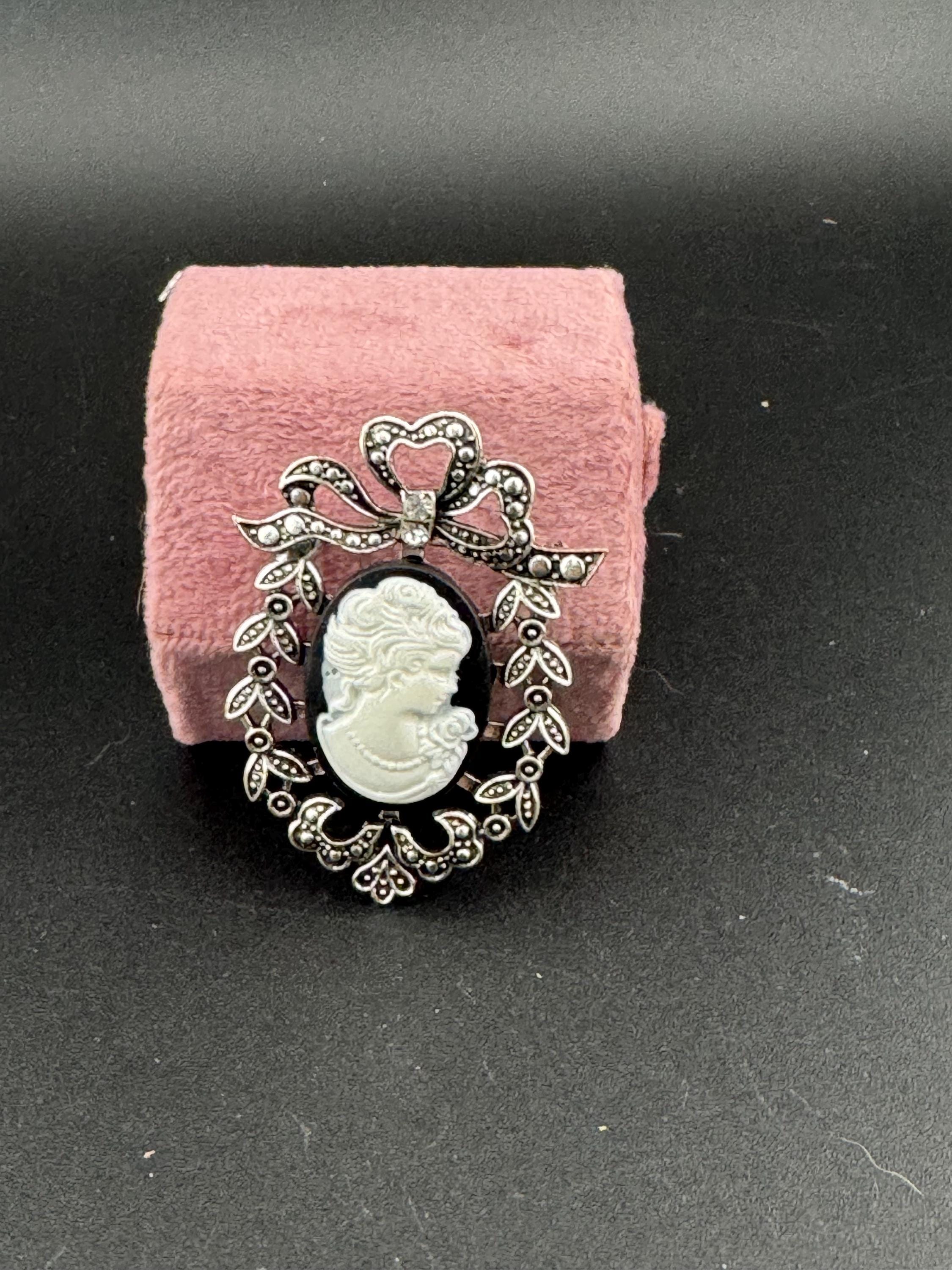 Vintage style handmade black and white cameo brooch with antique silver tone ornate frame