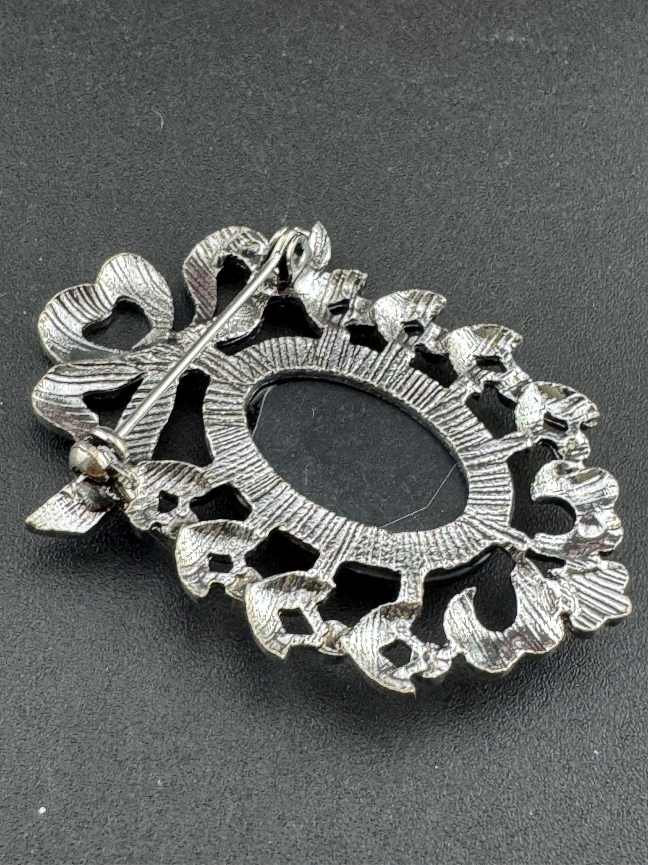 Vintage style handmade black and white cameo brooch with antique silver tone ornate frame