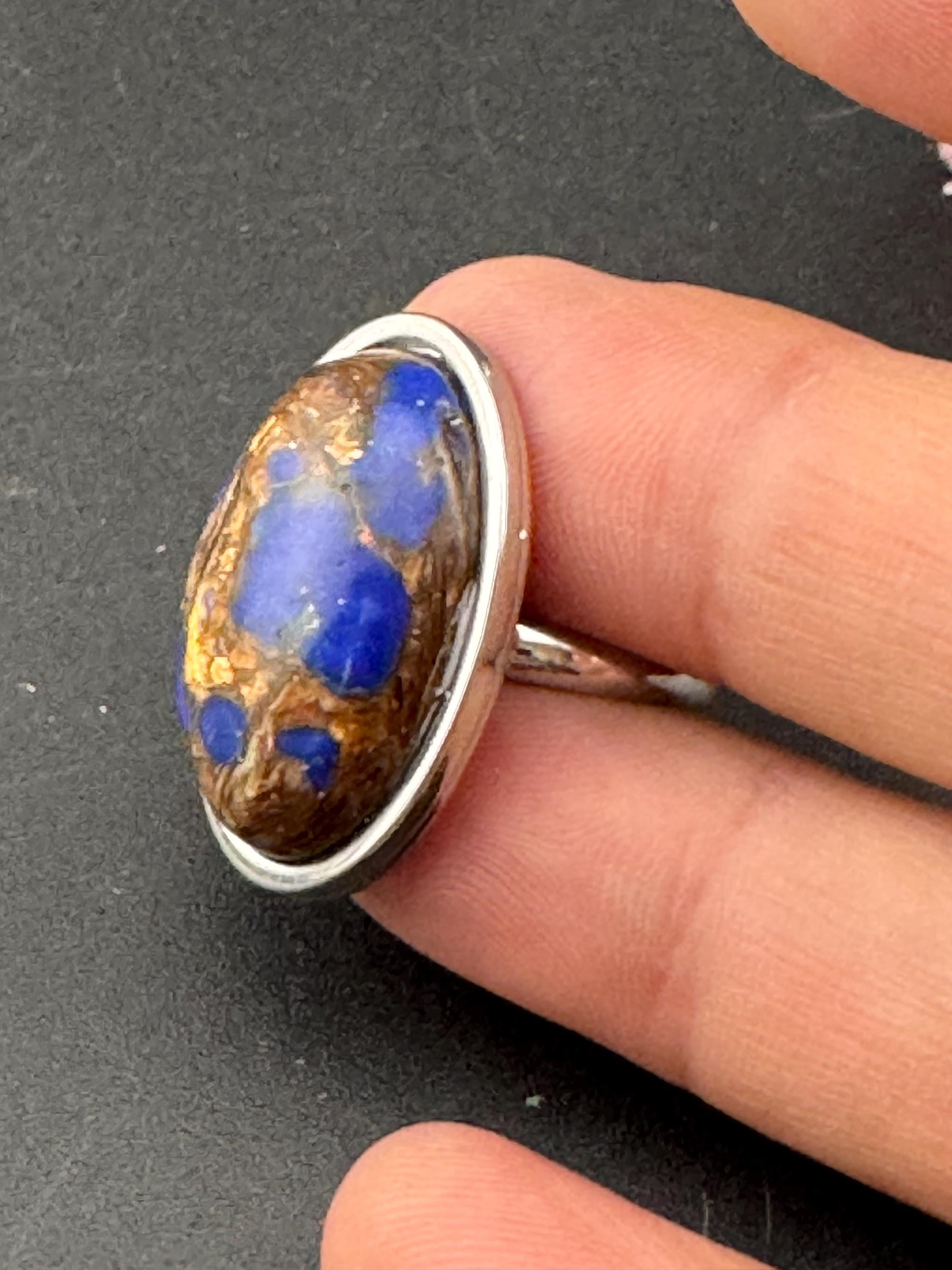 Oversized oval lapis lazuli blue and brown gemstone dress ring in non tarnish stainless steel, adjustable fit
