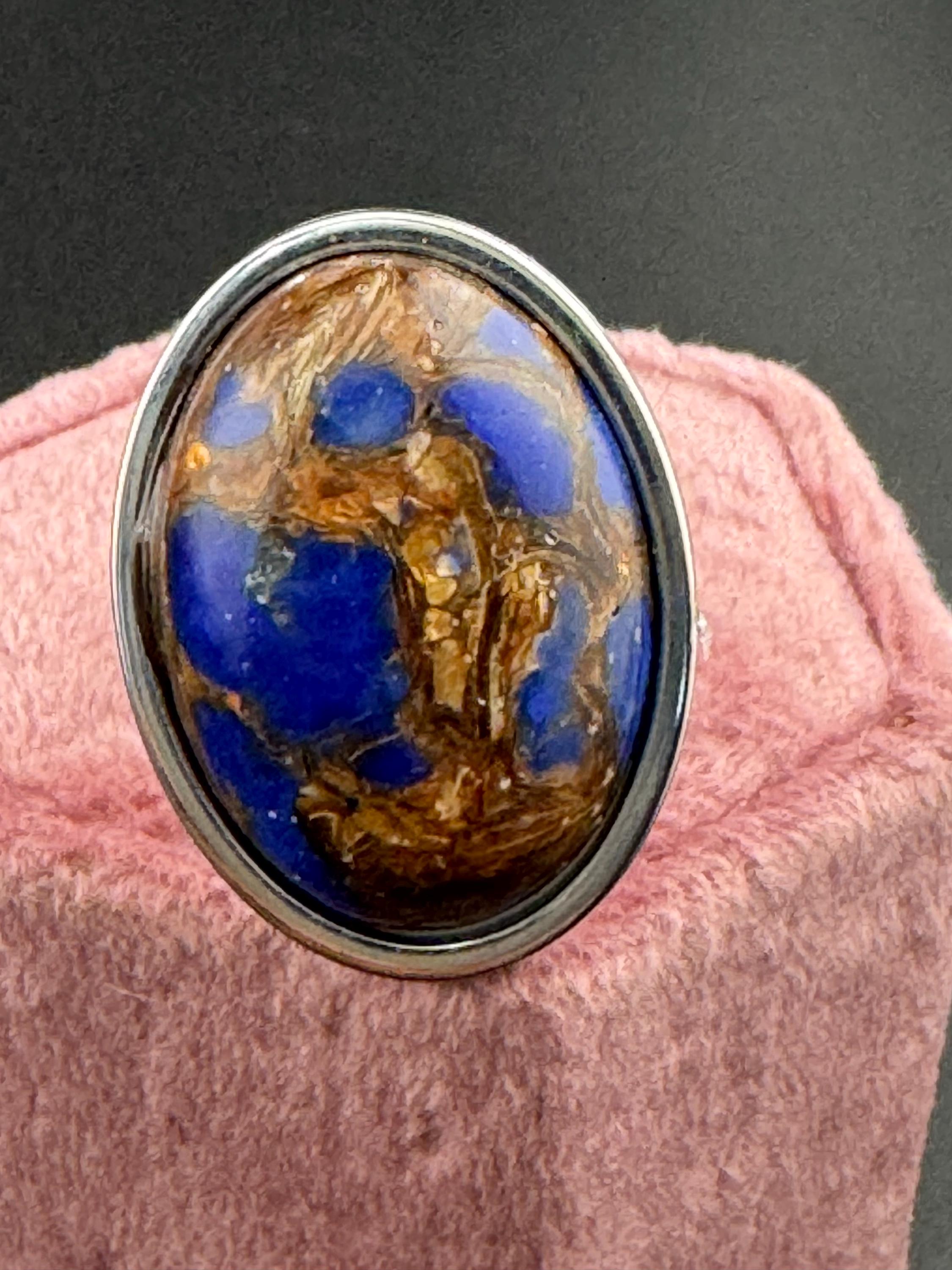 Oversized oval lapis lazuli blue and brown gemstone dress ring in non tarnish stainless steel, adjustable fit