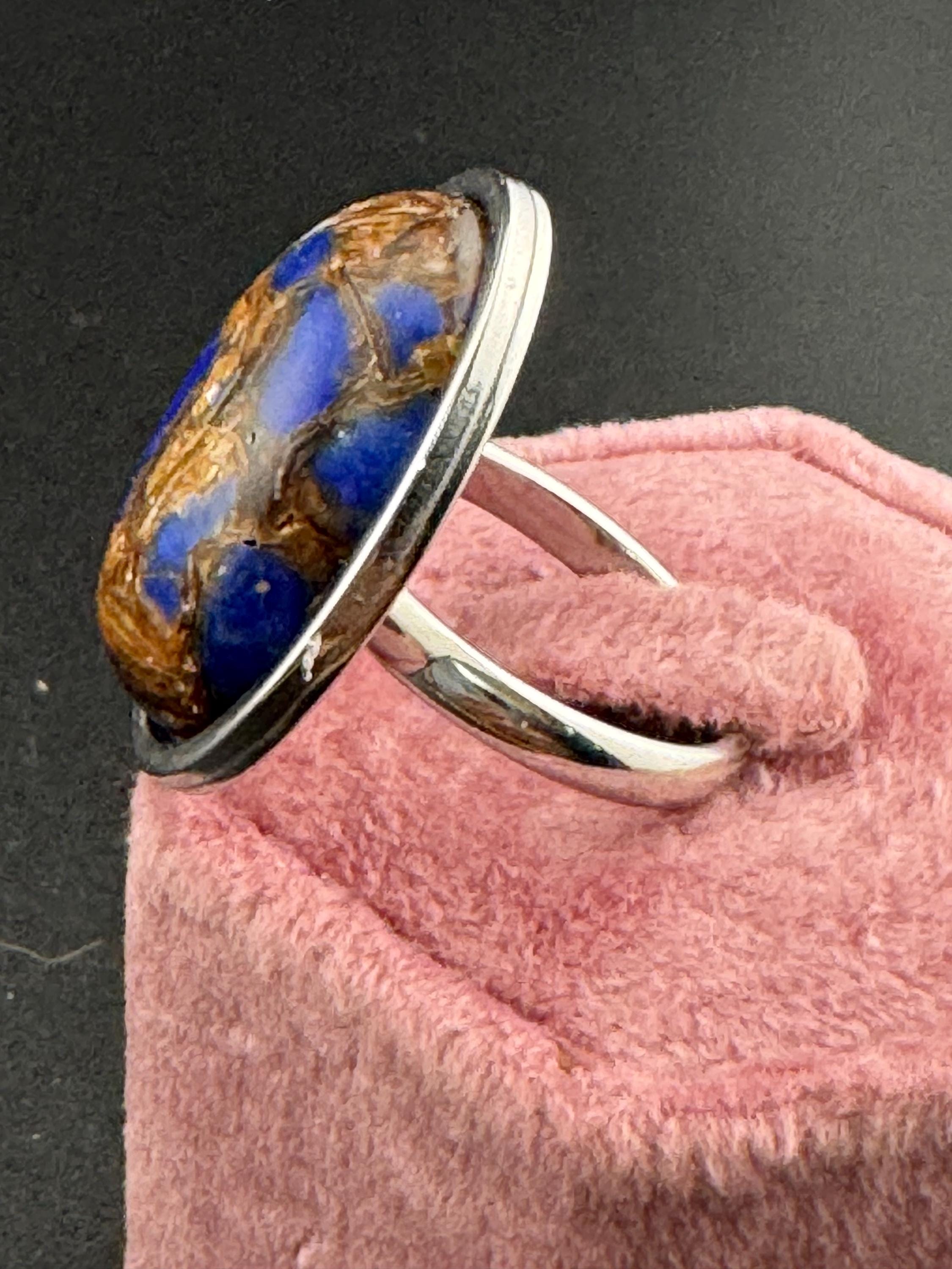 Oversized oval lapis lazuli blue and brown gemstone dress ring in non tarnish stainless steel, adjustable fit