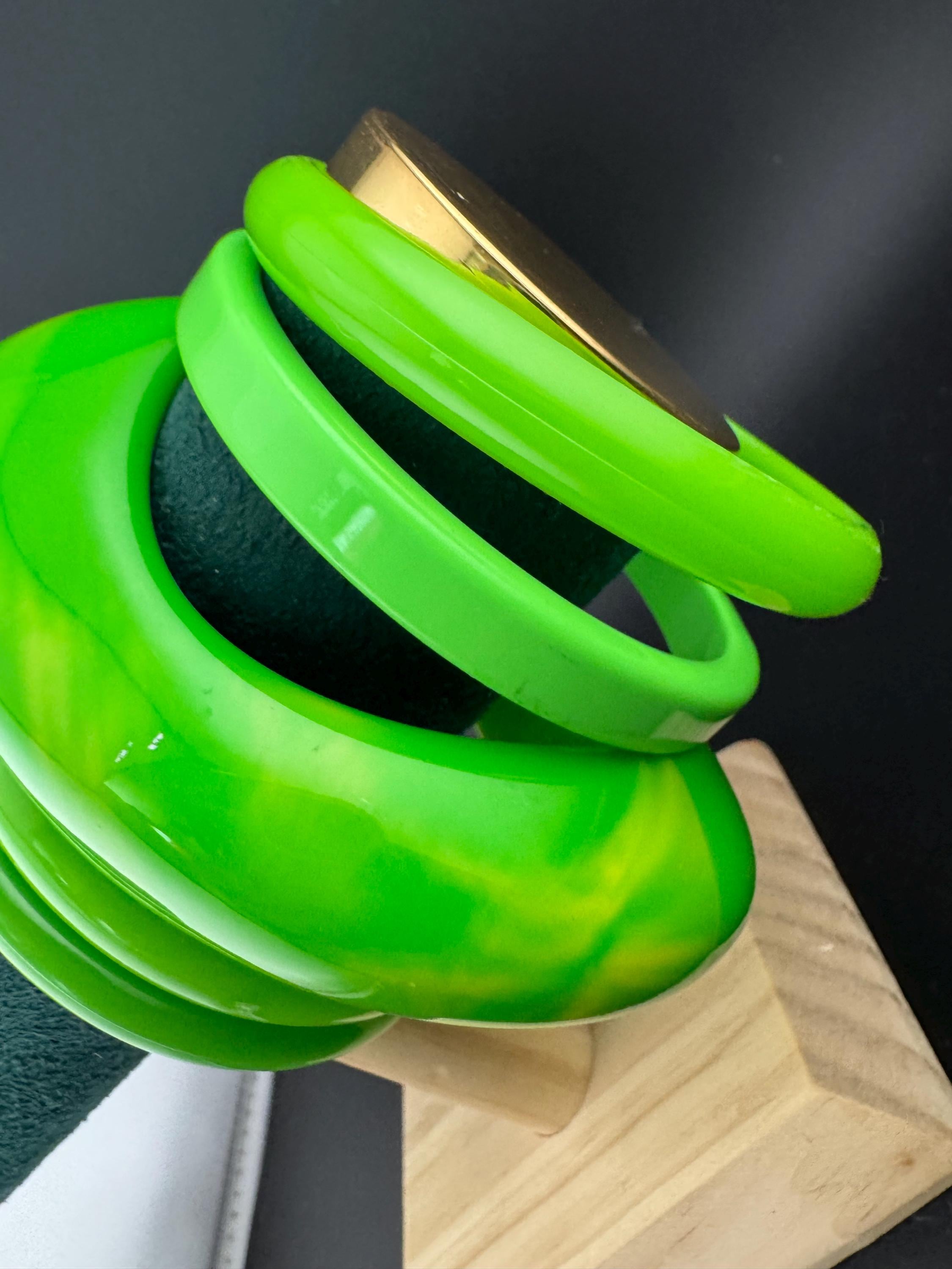 Vintage and retro curated stack of GREEN plastic acrylic bangles, bracelets
