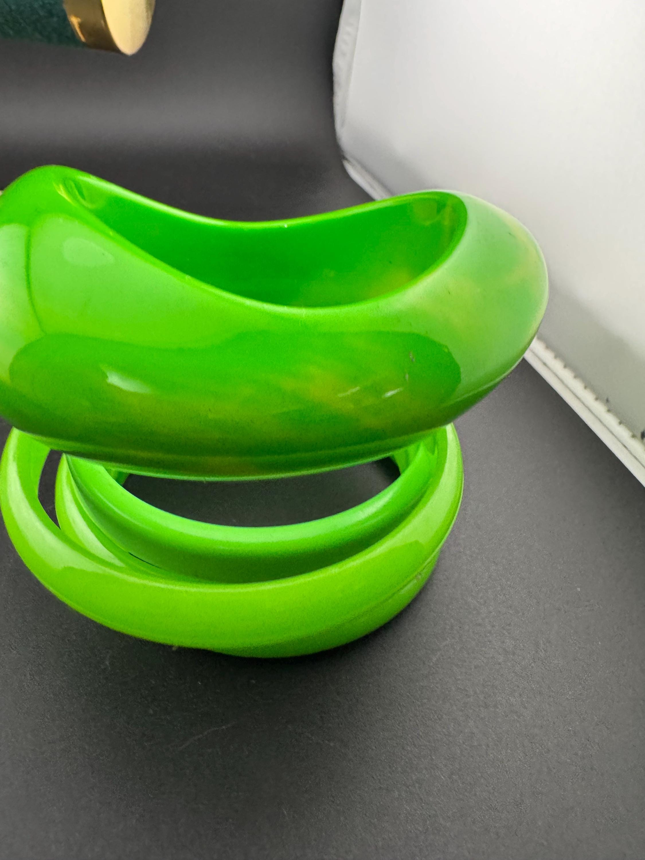 Vintage and retro curated stack of GREEN plastic acrylic bangles, bracelets