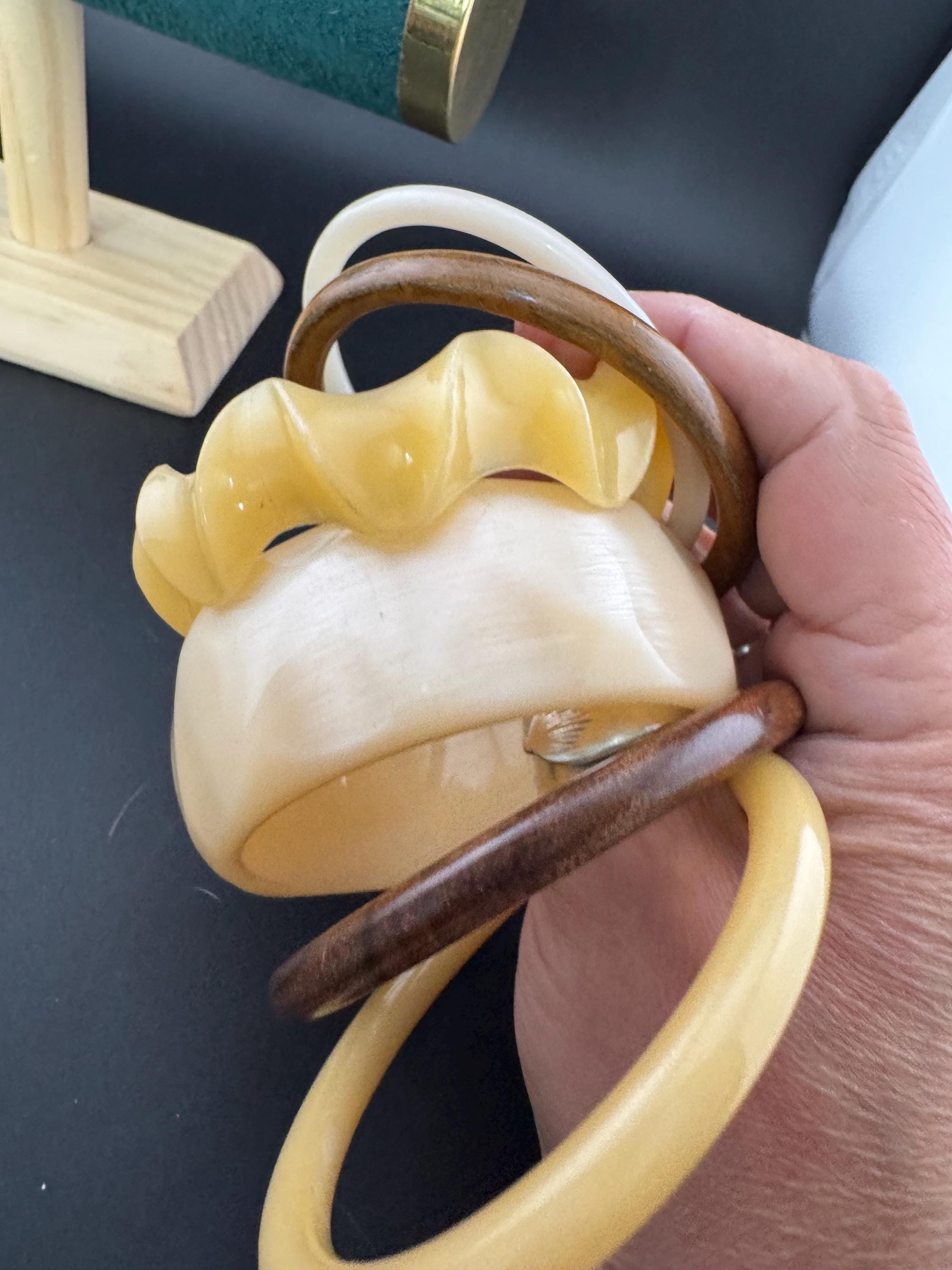 A curated stack of Cream brown beige neutrals vintage and retro plastic wooden bangles