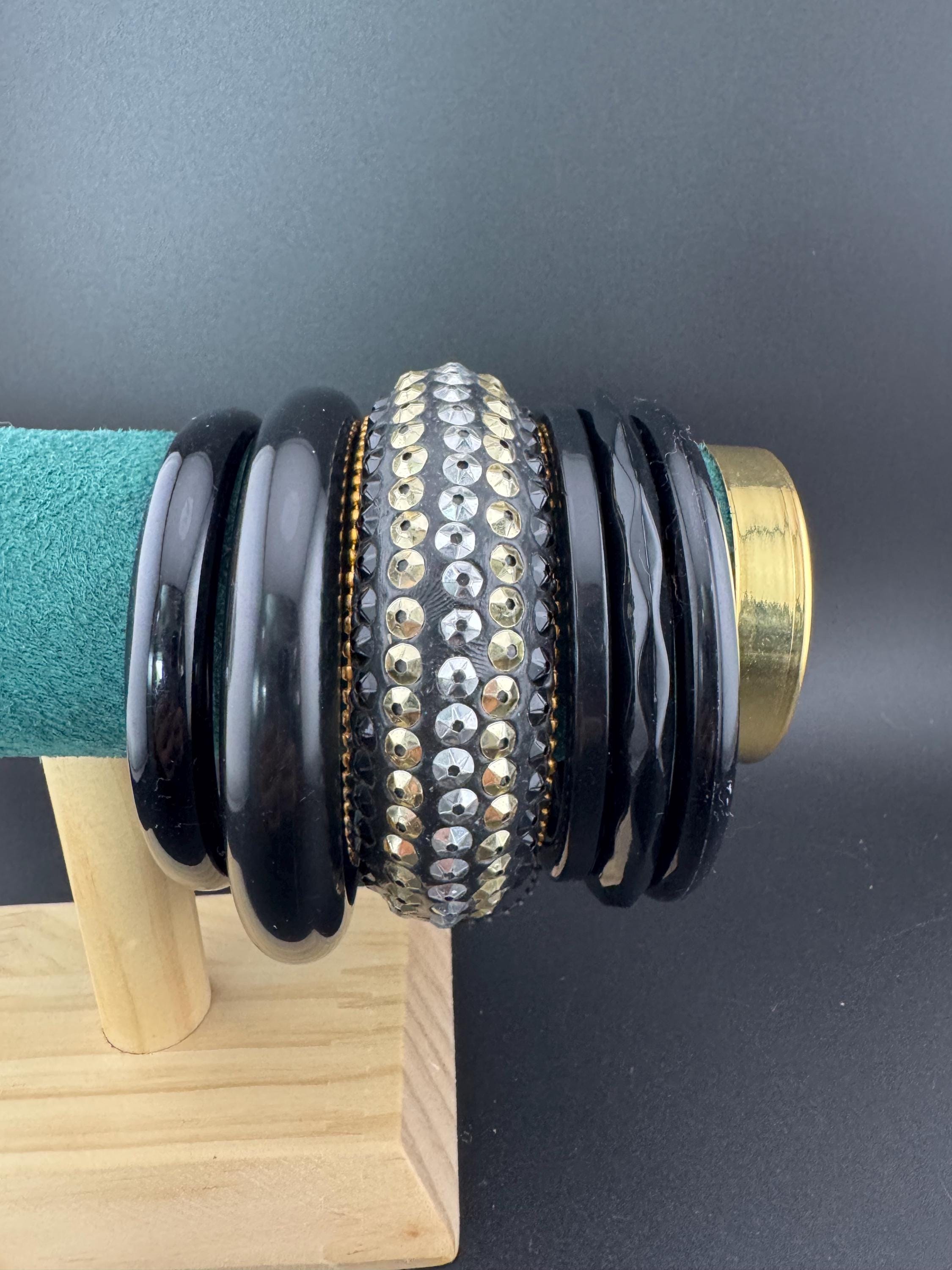 A curated set of vintage and retro gold black tones stacking bangles, boho festival bracelets