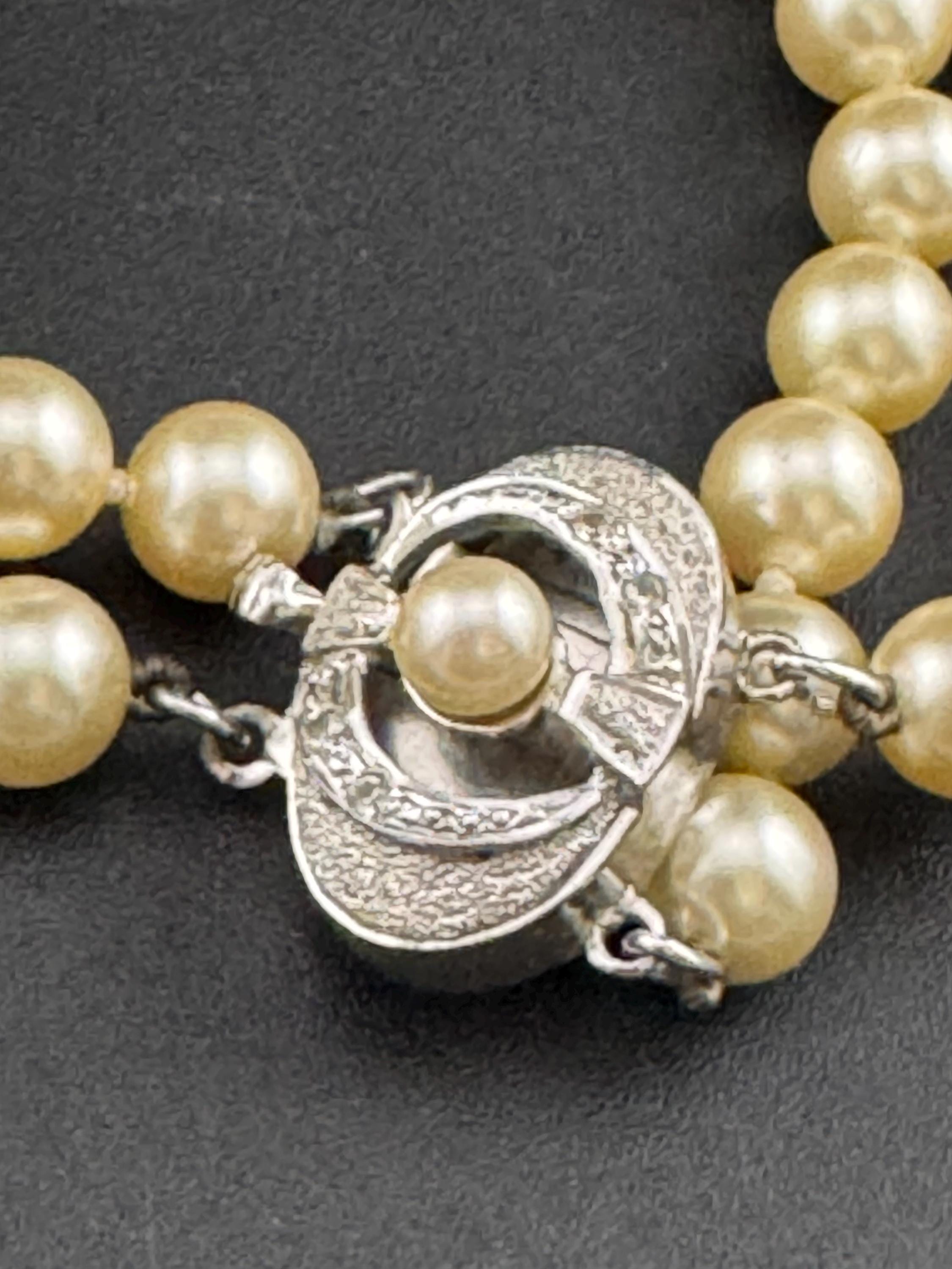 Vintage Sterling 925 Silver knotted faux pearl double row bracelet with ornate clasp with seahorse and starfish logo on