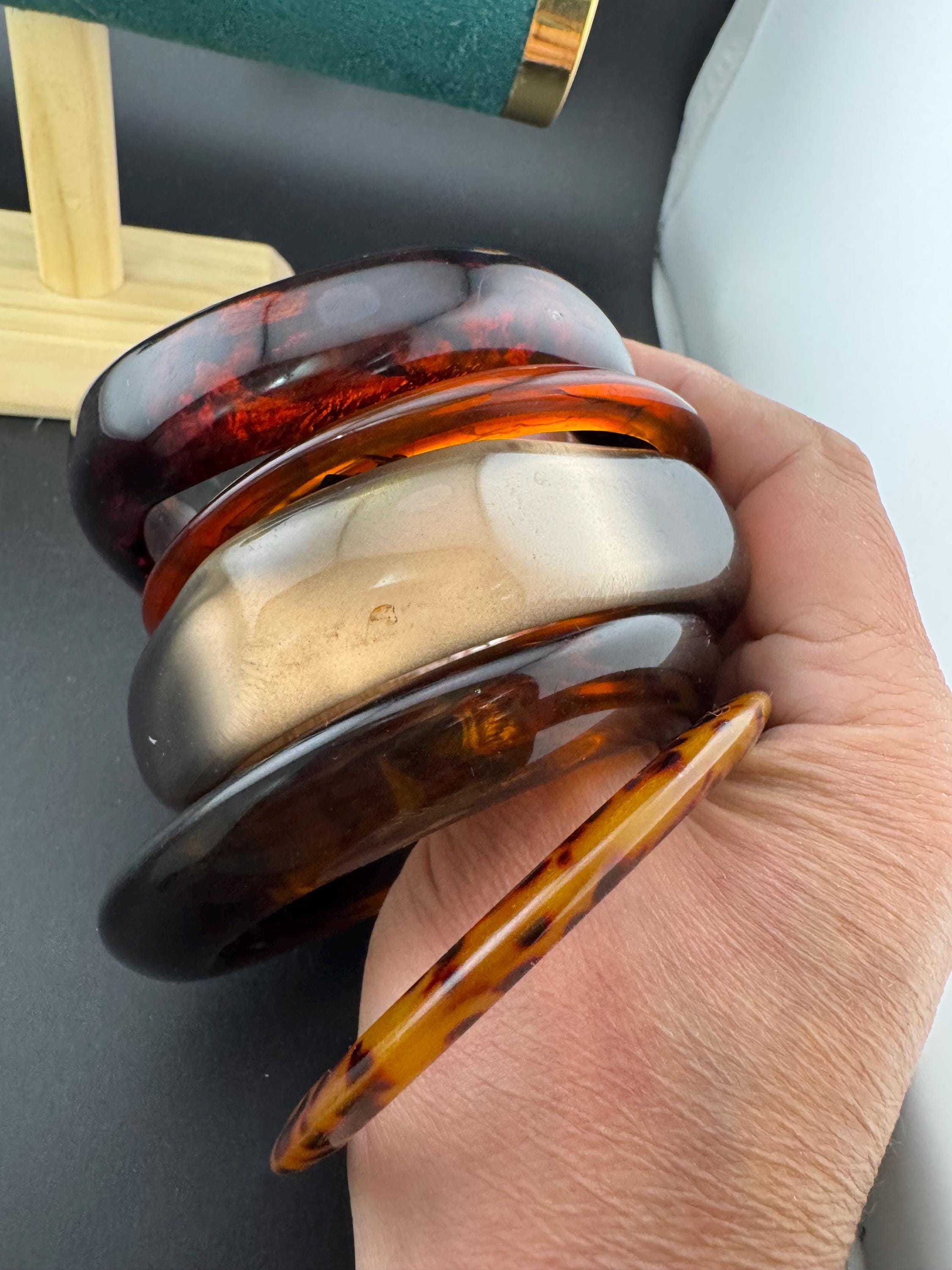 A curated stack of Faux tortoiseshell brown Perspex plastic wide cuff bangle bracelets ideal stacking layering Vintage