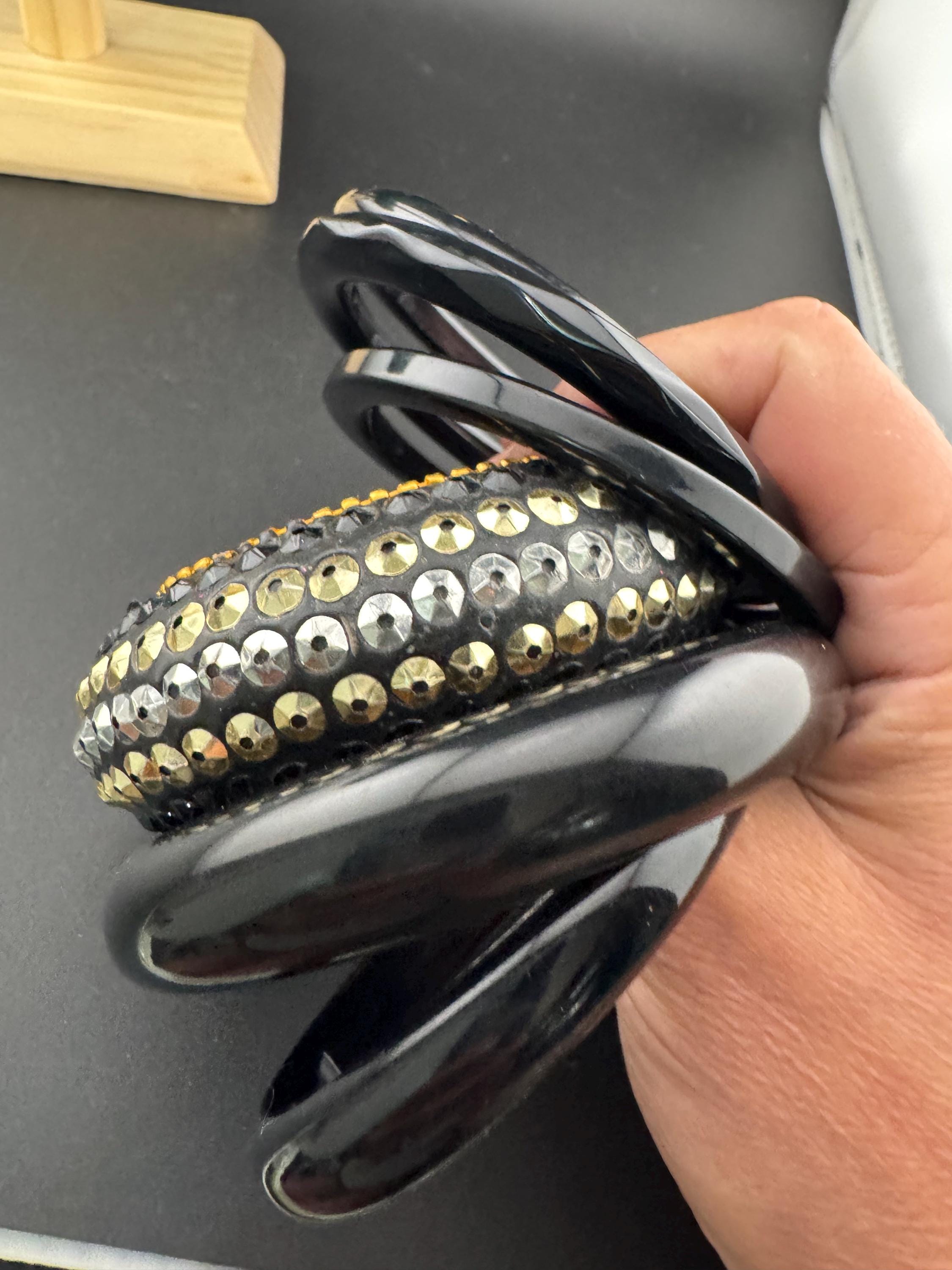 A curated set of vintage and retro gold black tones stacking bangles, boho festival bracelets