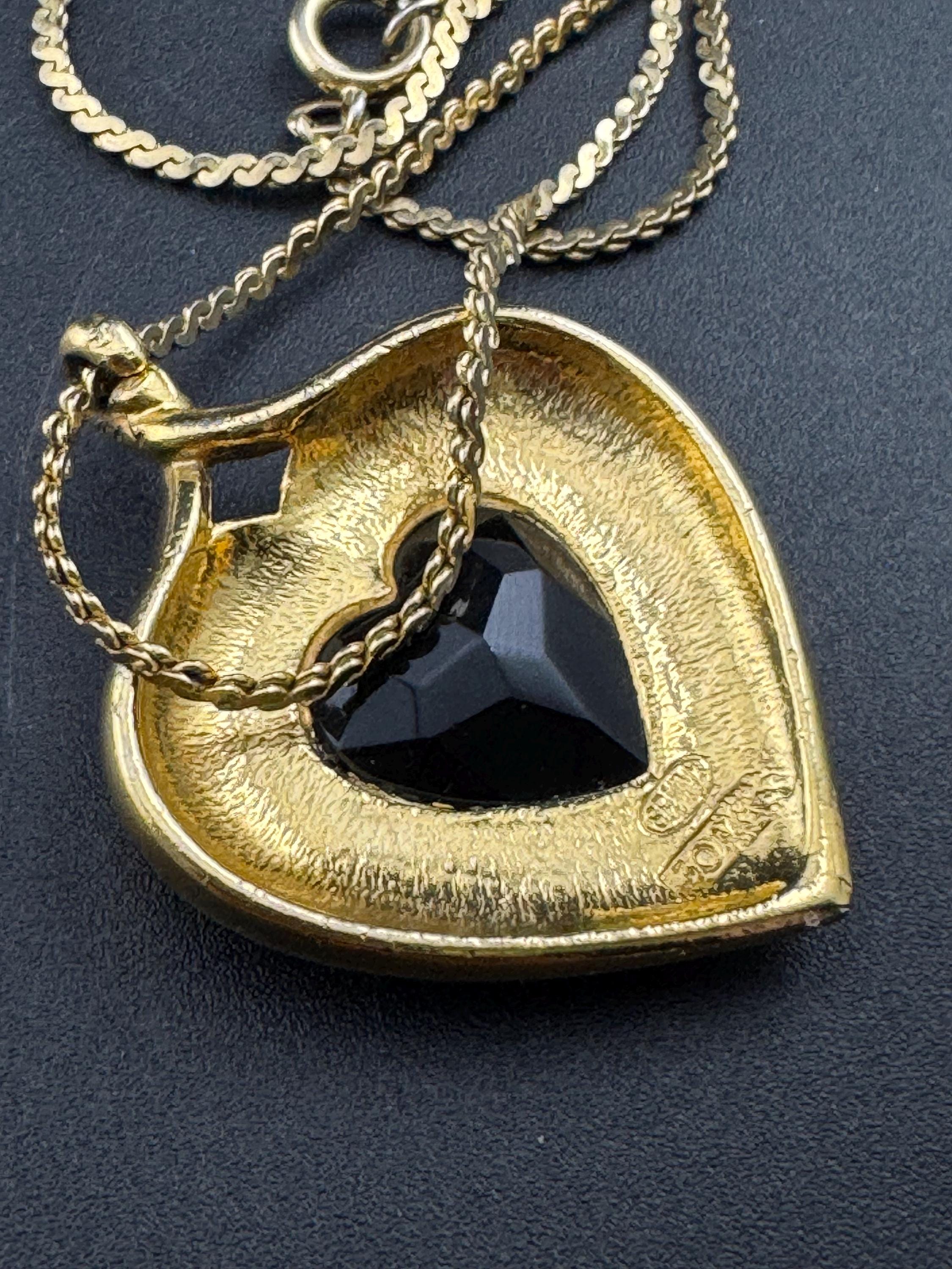 Signed Sphinx black glass crystal love heart diamanté pendant necklace on a long gold plated serpentine chain