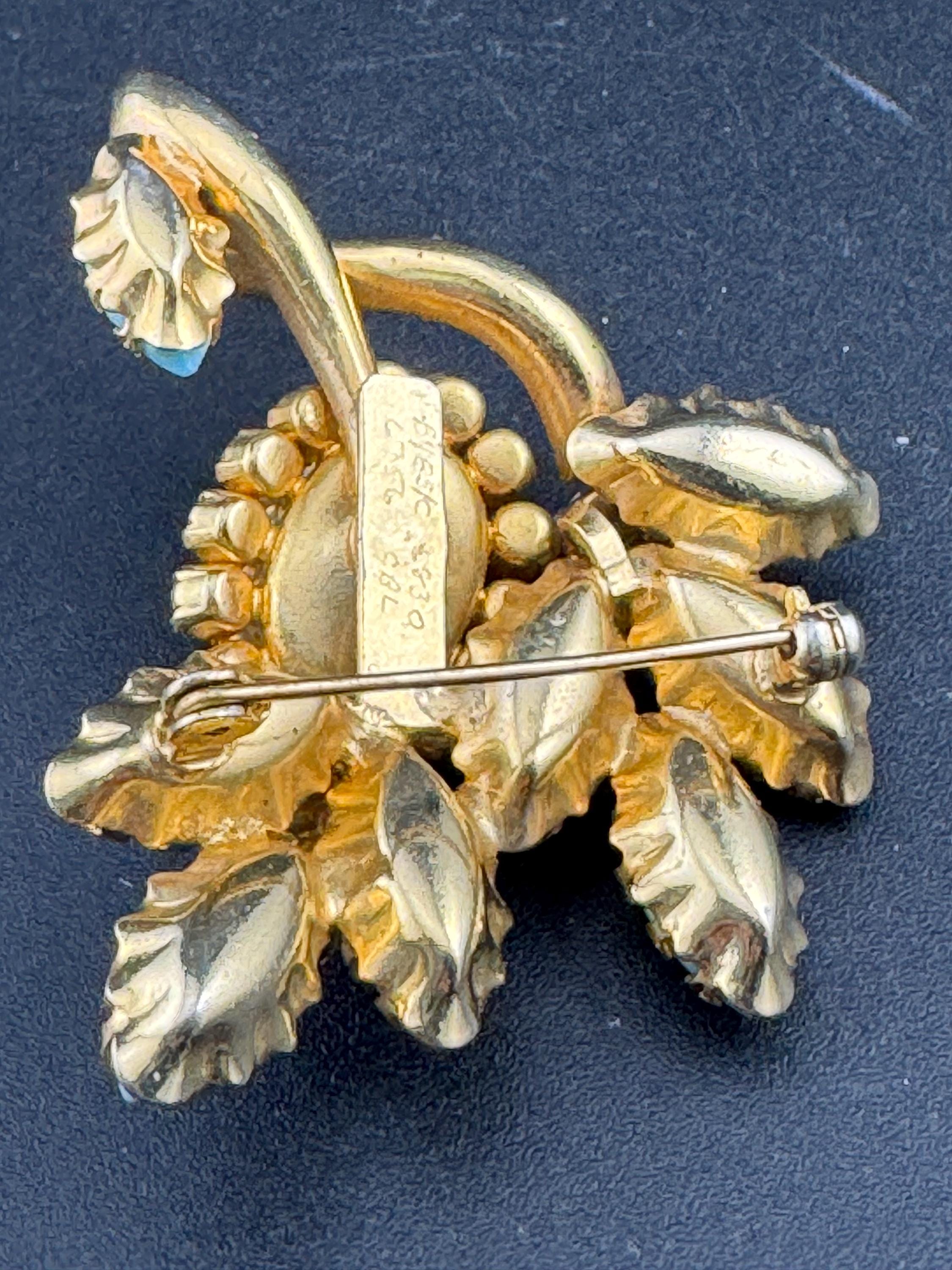 gold tone turquoise cabochon and amethyst rhinestone large floral statement brooch 1960s