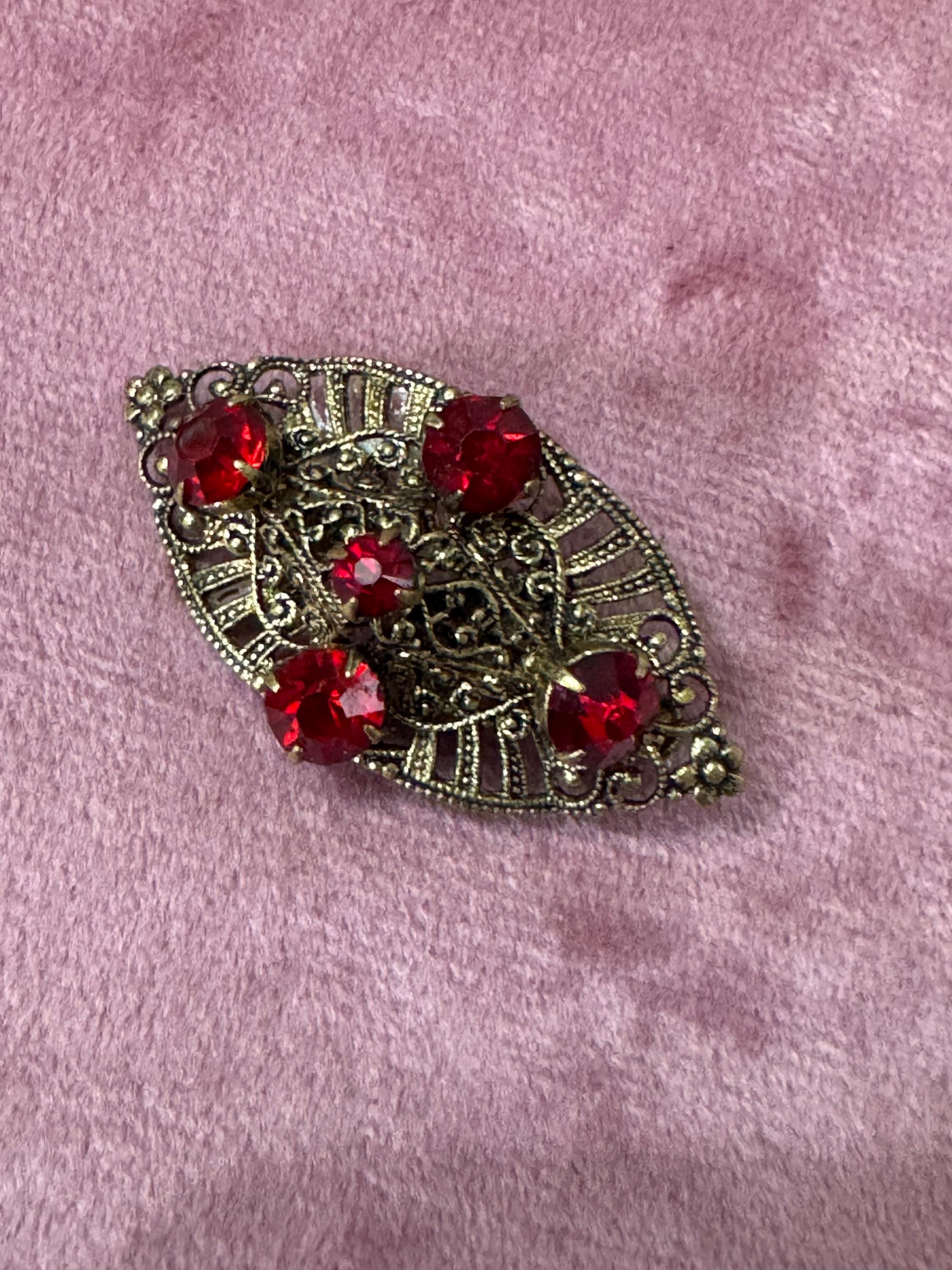 Antique Art Deco Czech brass gilt metal filigree brooch with red faux ruby glass paste rhinestones ornate