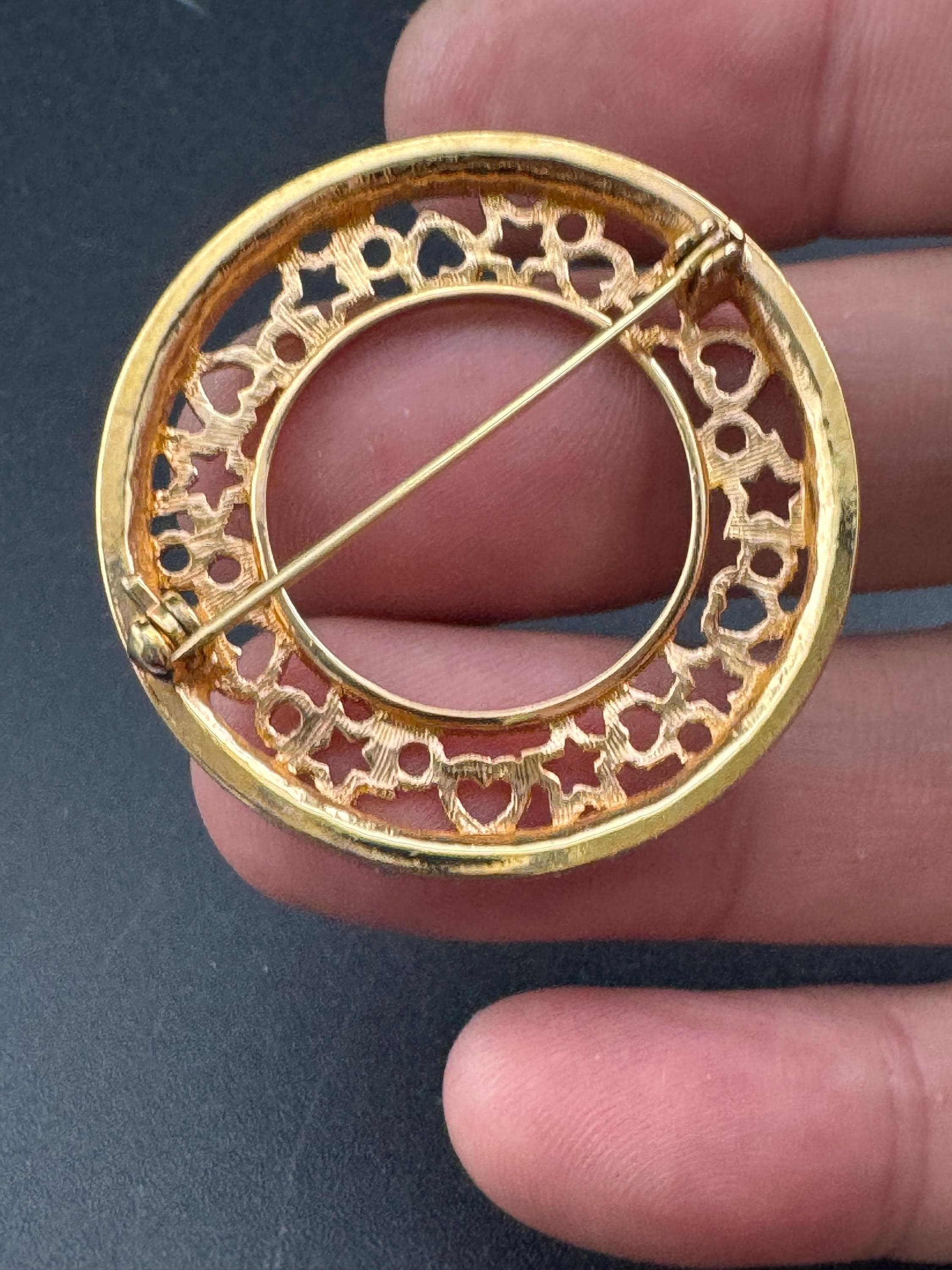 Vintage round openwork gold tone brooch channel set with clear rhinestones , sleek modernist design