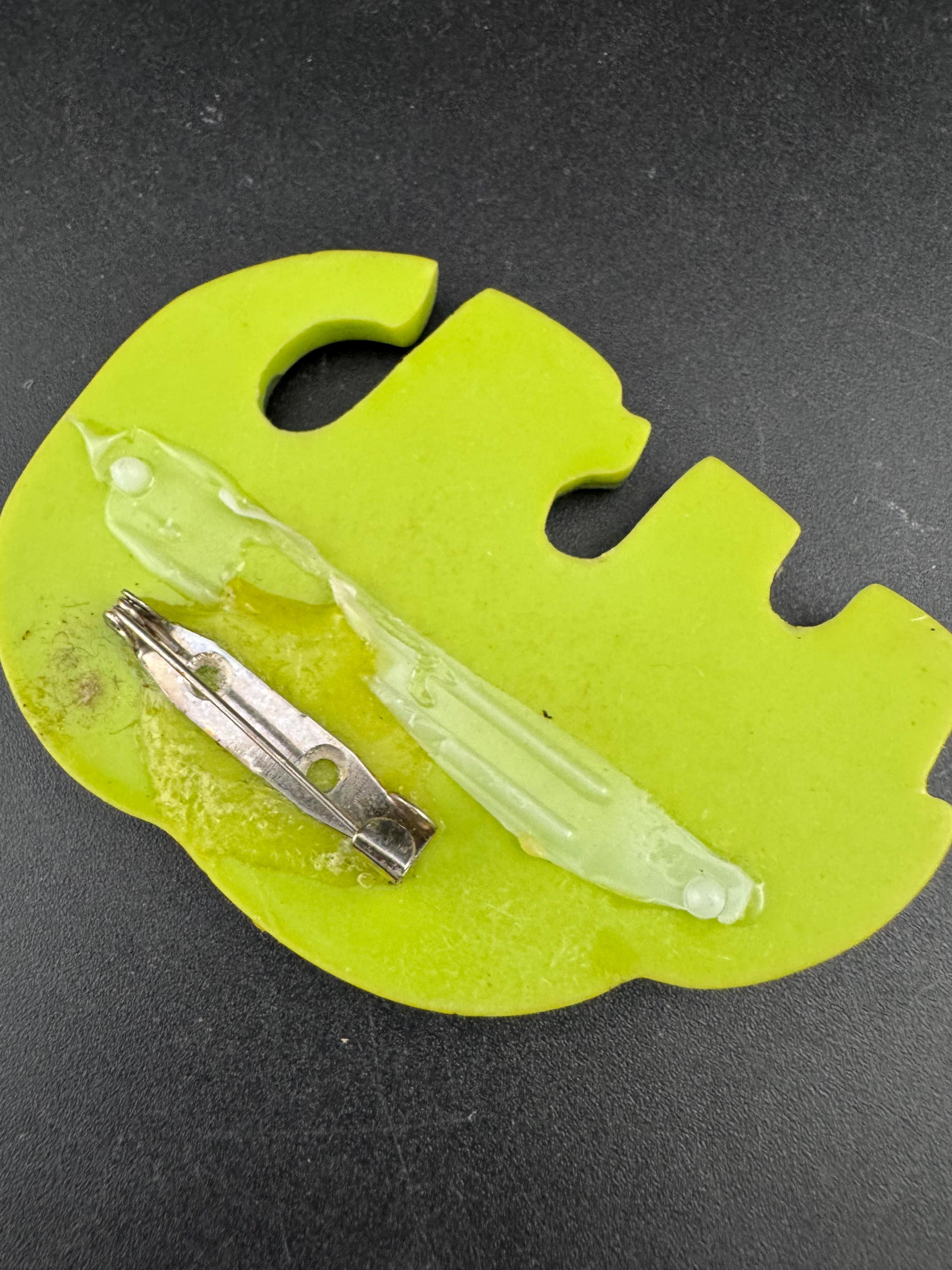 big lime green elephant and baby brooch inset with abalone shell, early plastic 1960s