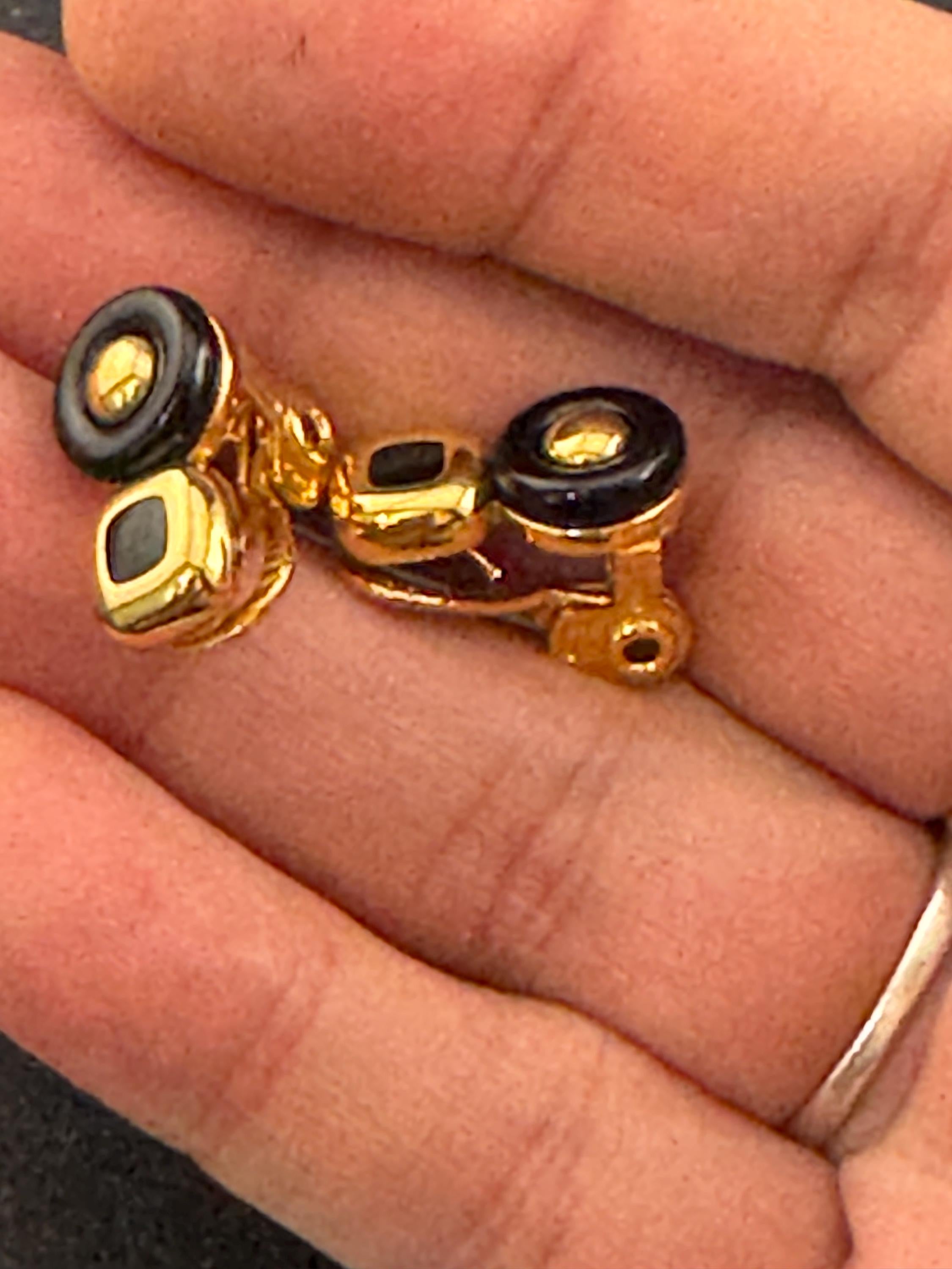 Signed MONET Gold tone black cabochon clip on earrings