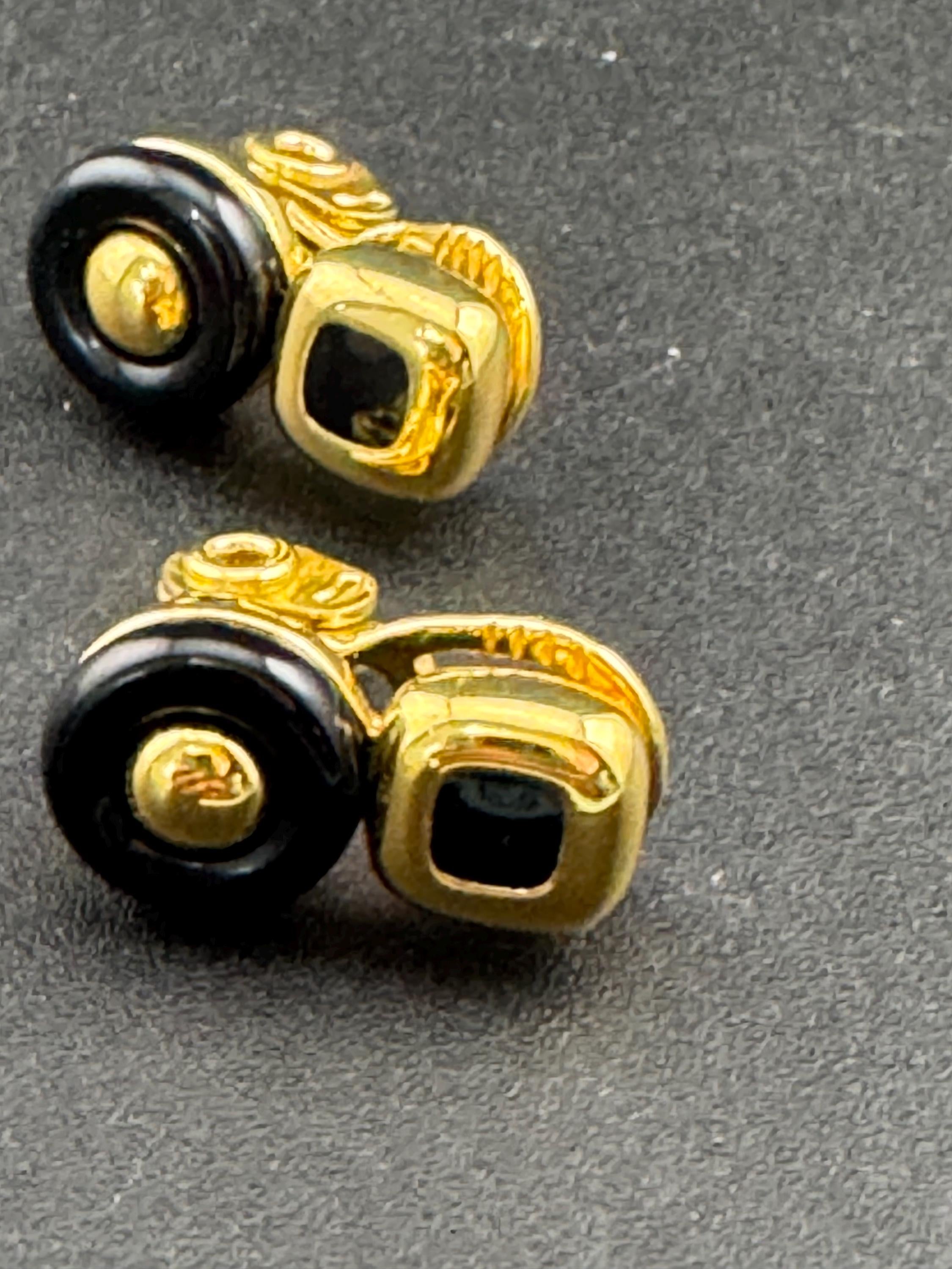 Signed MONET Gold tone black cabochon clip on earrings