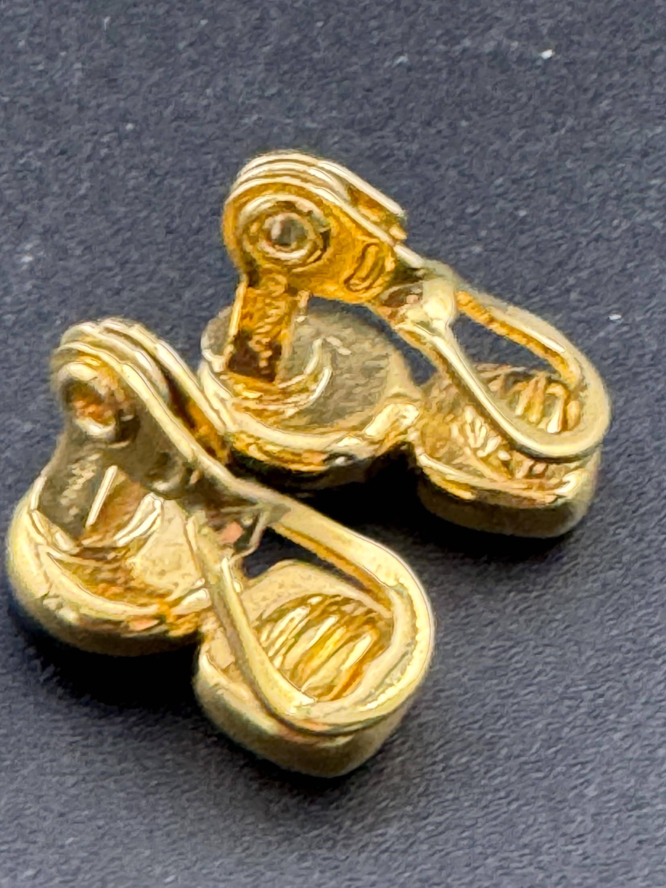 Signed MONET Gold tone black cabochon clip on earrings