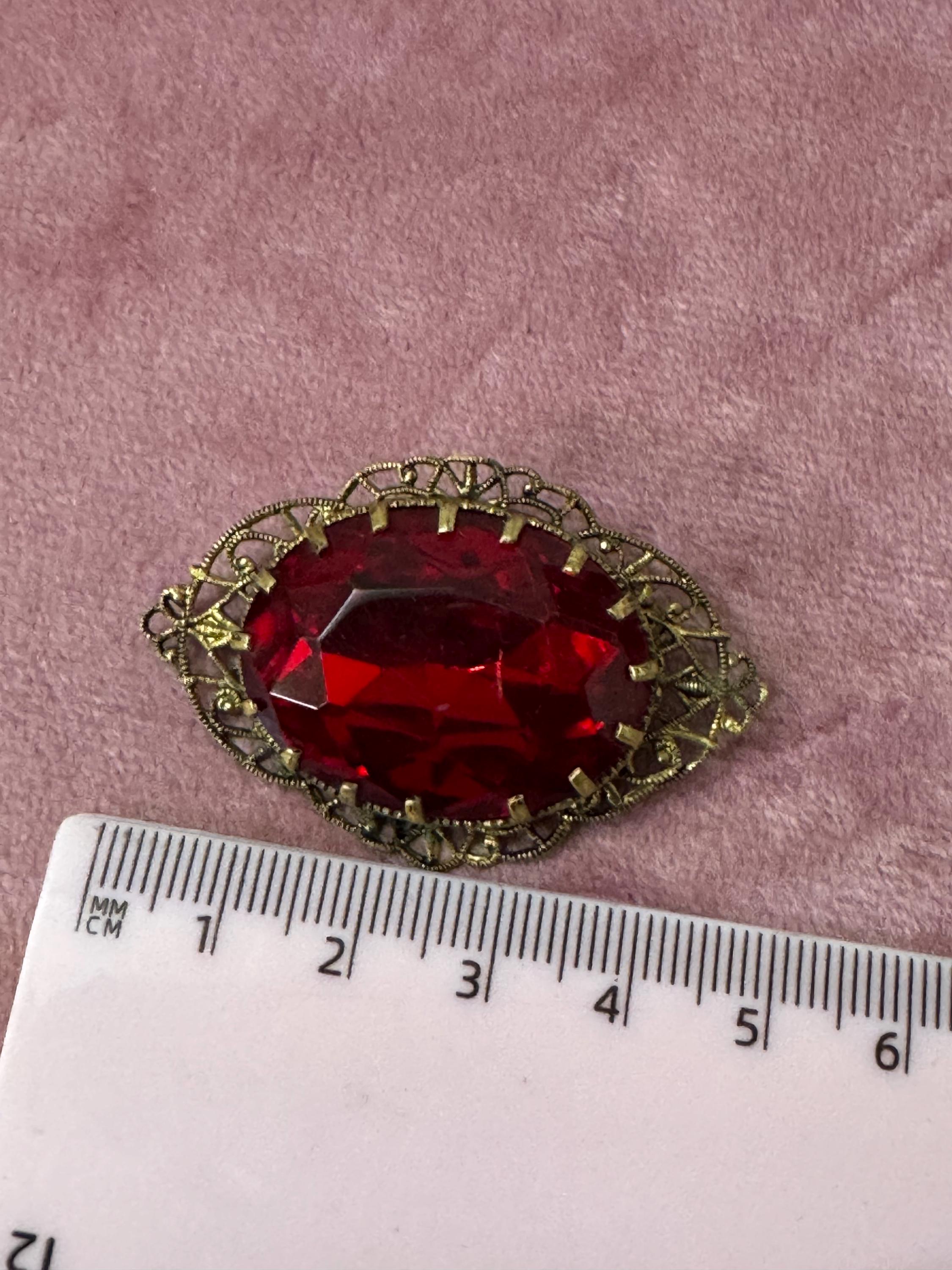 Antique Art Deco Czech brass gilt metal filigree brooch with red faux ruby glass paste rhinestones ornate