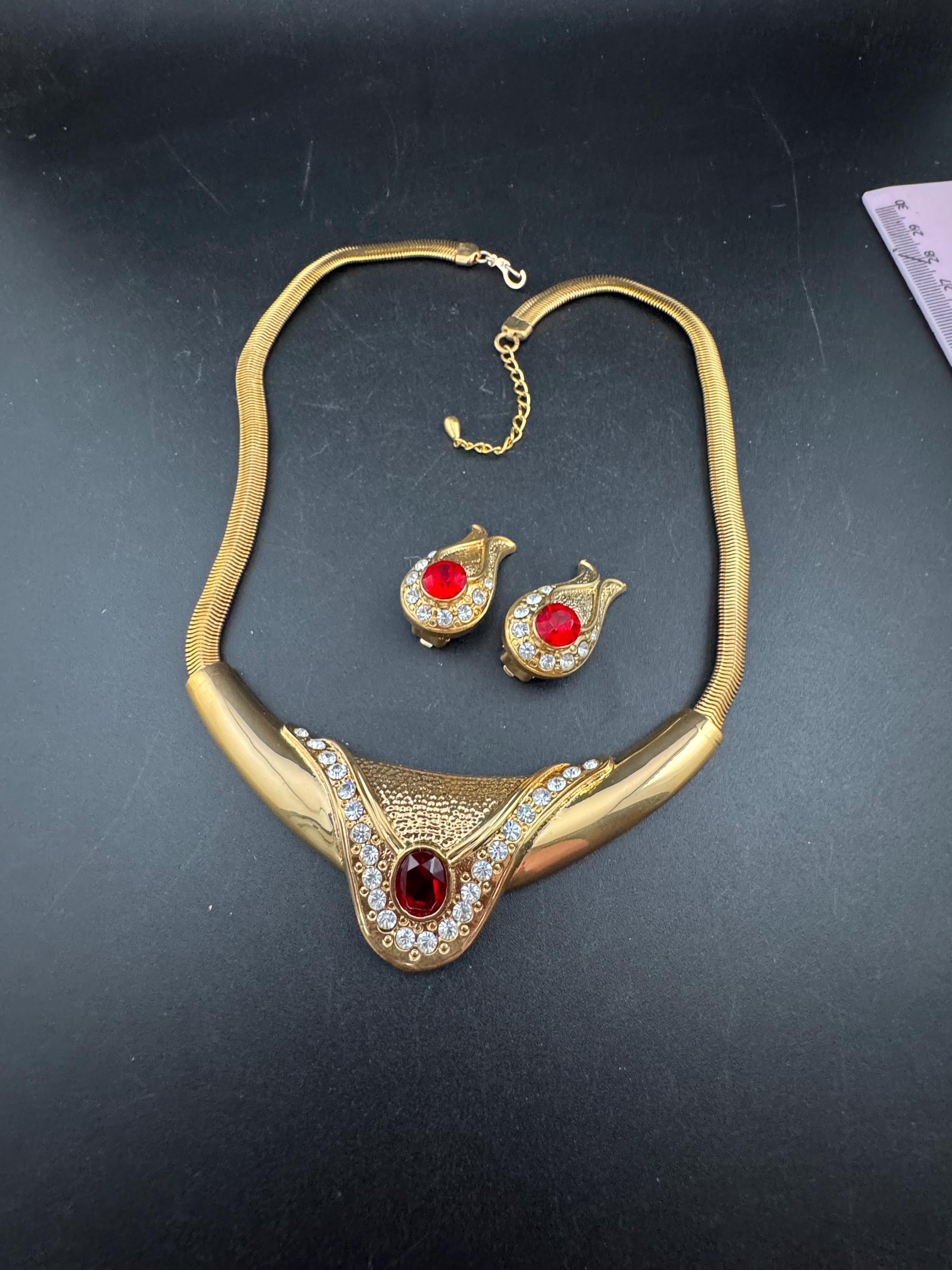 vintage 1980s high end ruby red and clear crystal gold choker necklace and matching clip on earrings, unused retro jewelry set
