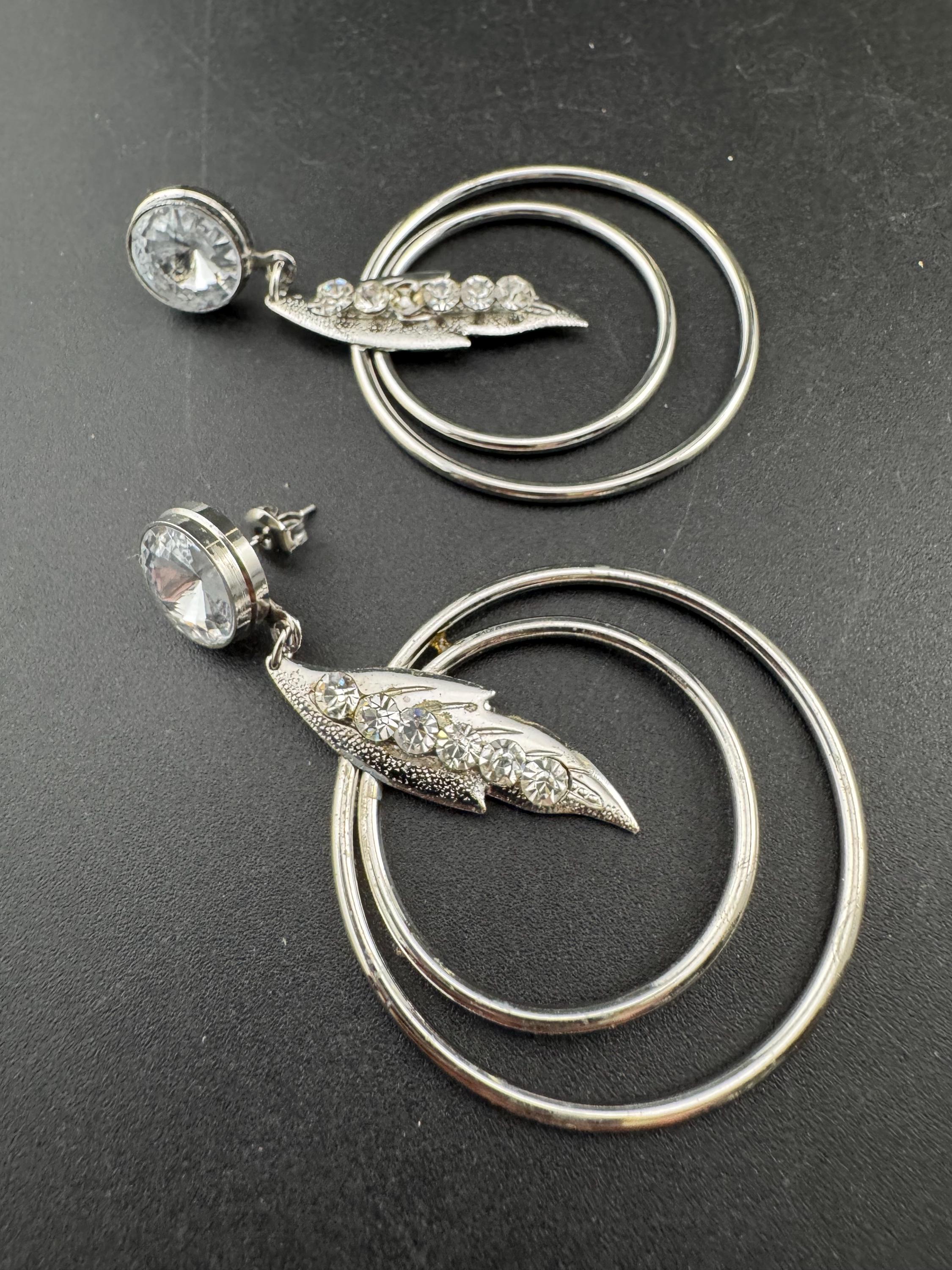 Vintage modernist silver tone 1980s big hoop drop earrings set with clear crystal and metal rings for pierced ears