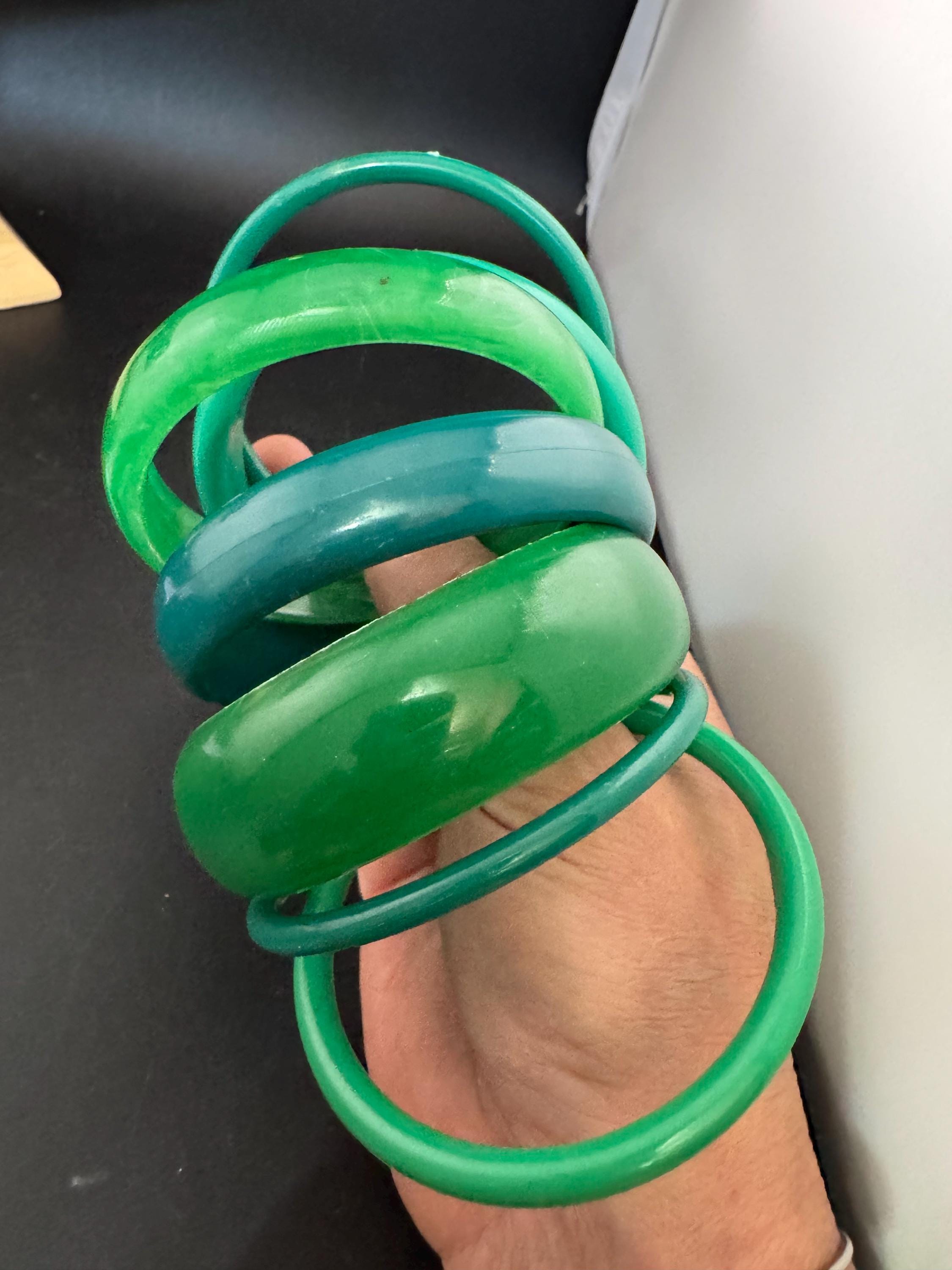 Vintage and retro curated stack of GREEN plastic acrylic bangles, bracelets