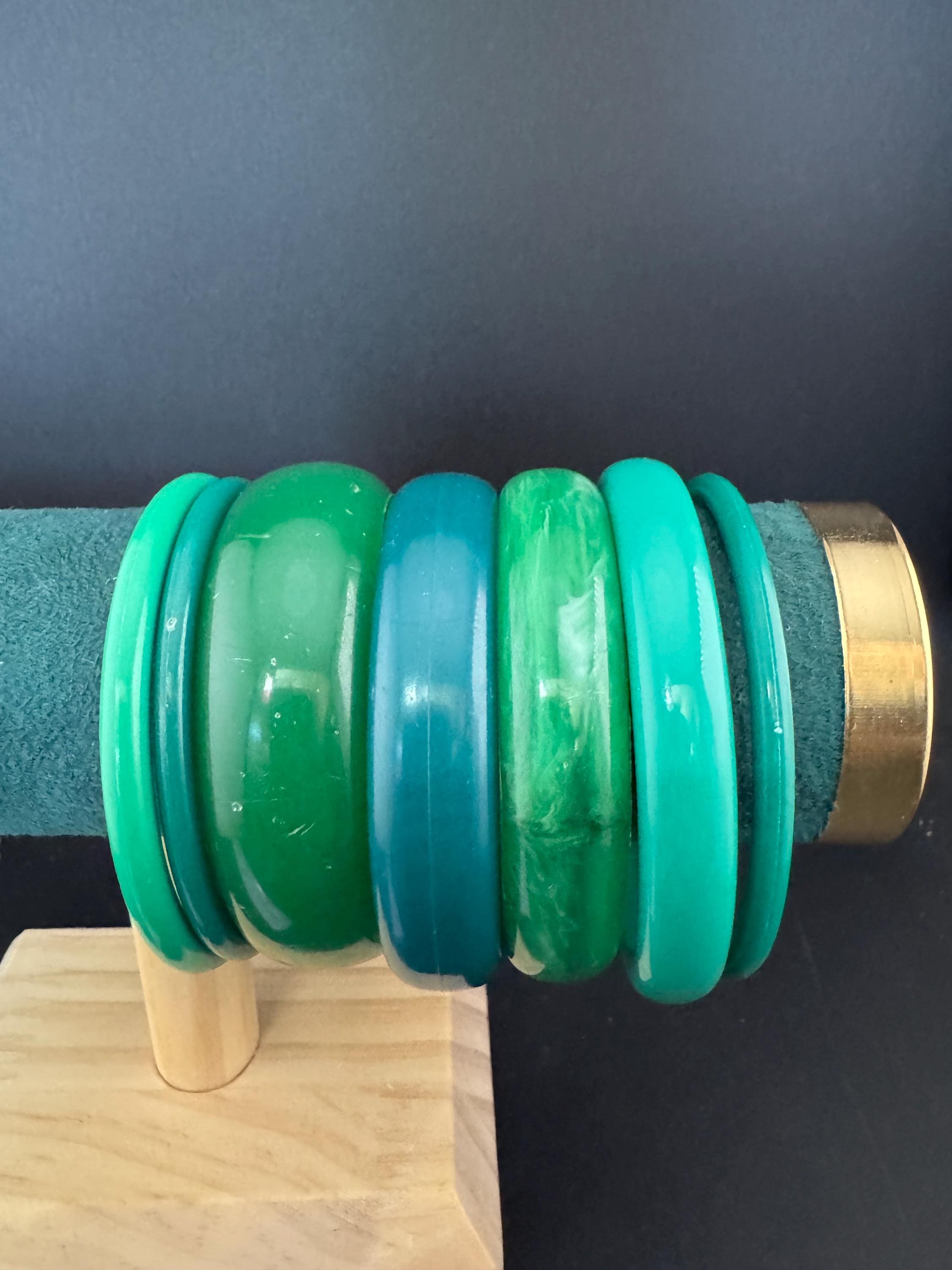 Vintage and retro curated stack of GREEN plastic acrylic bangles, bracelets