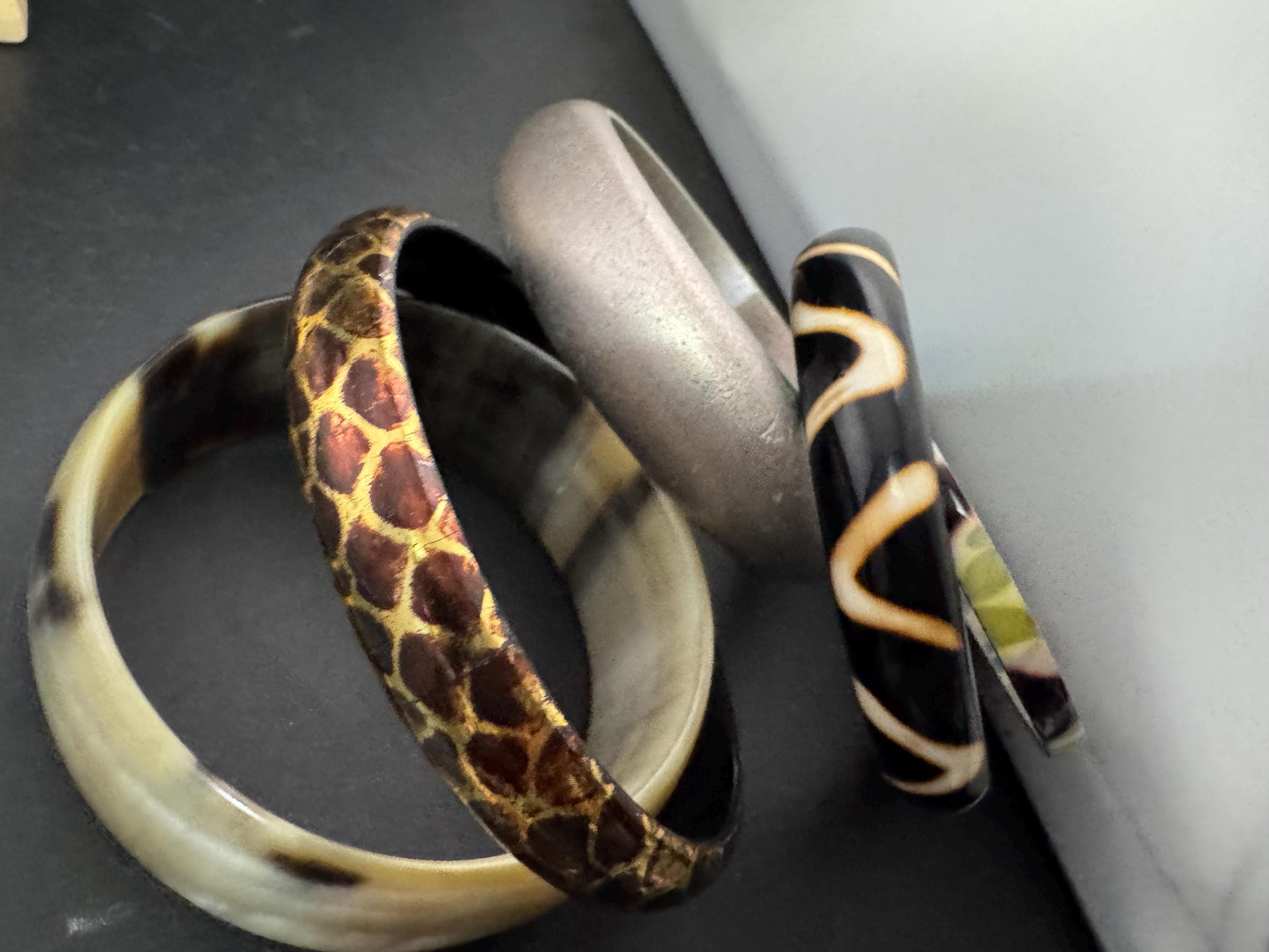 Cream brown yellow animal print beige stack of vintage retro plastic metal bangles
