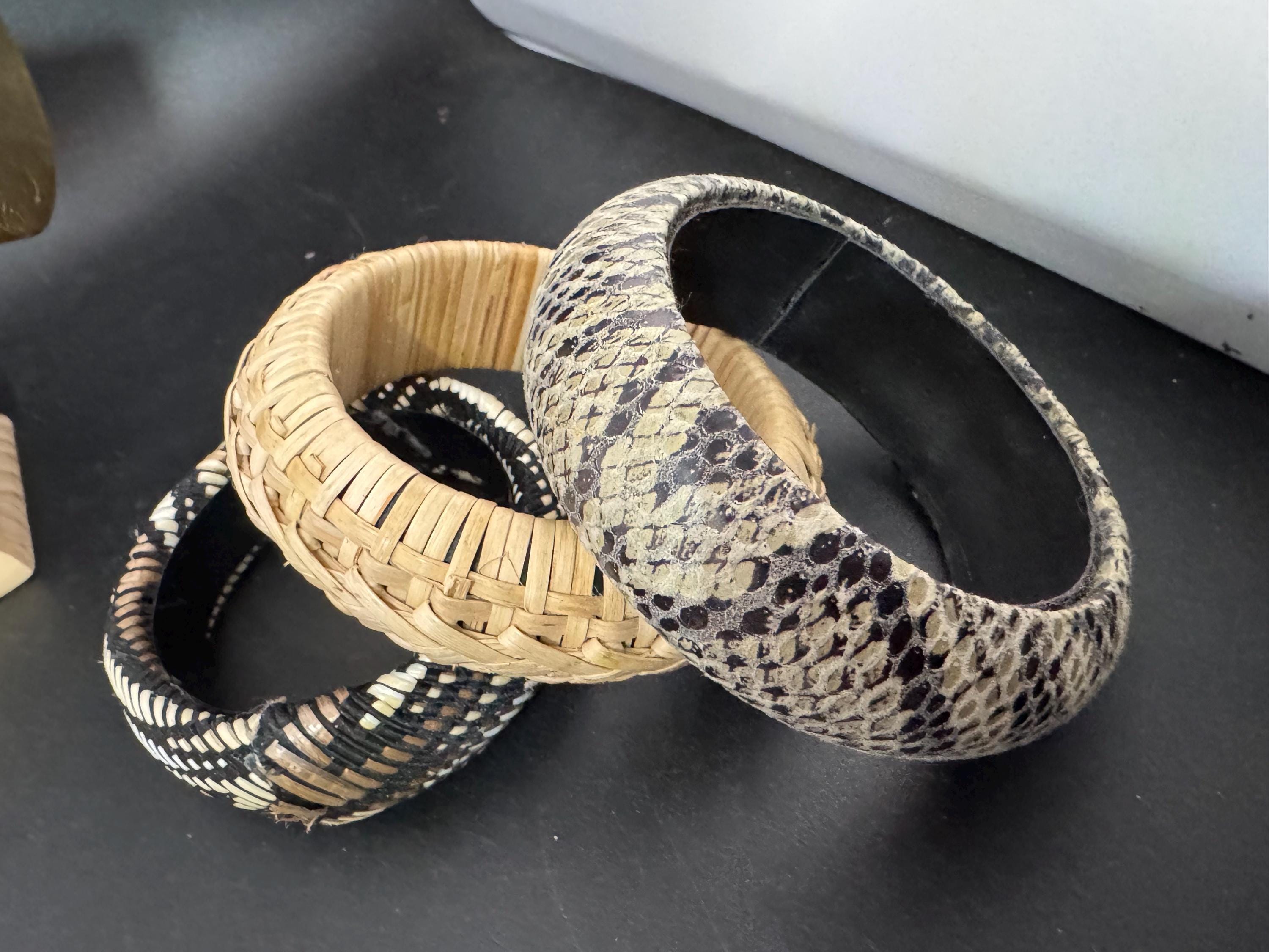 Curated stack of vintage wooden plastic and metal stacking bangles in brown natural shades ethnic tribal boho festival bracelets