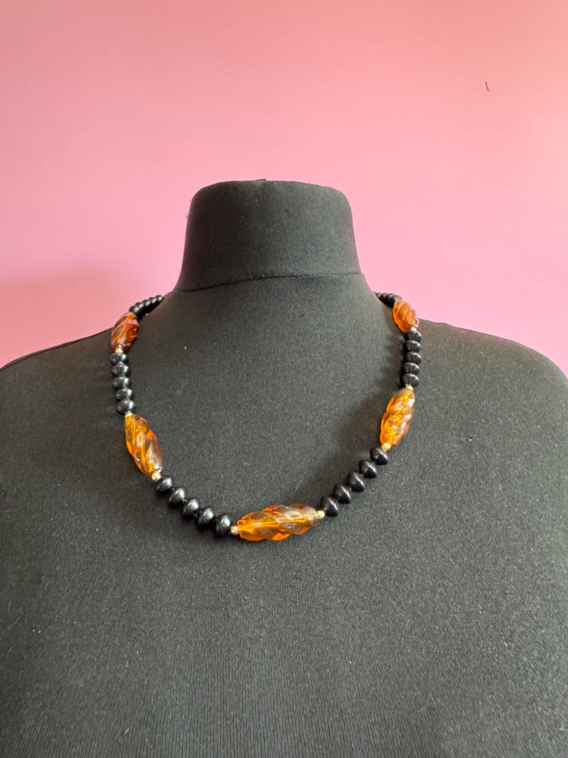 Long faux amber brown plastic beaded necklace with black beads 70s early 80s , 63cm