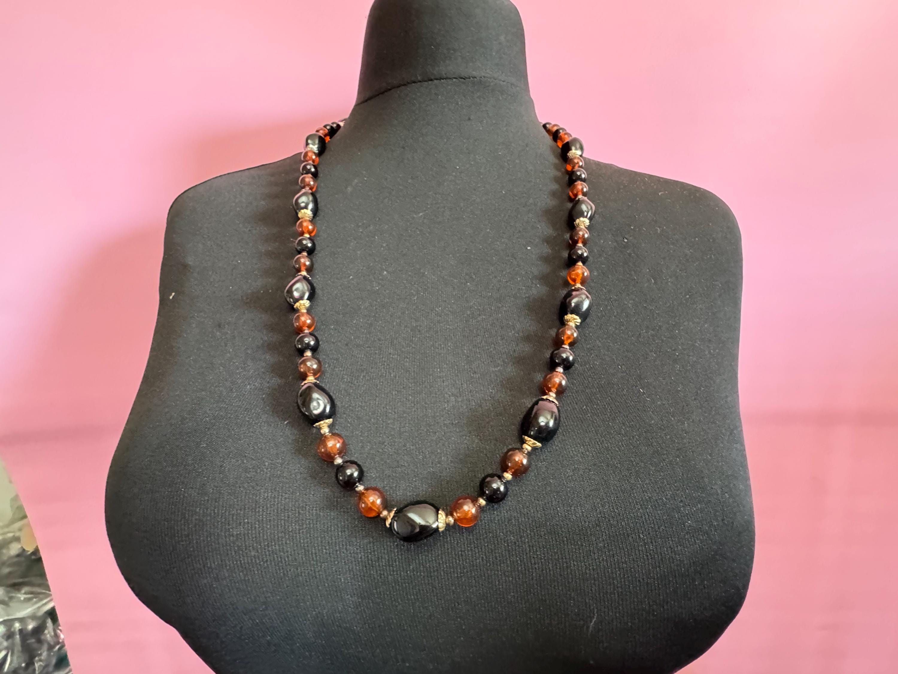 Long brown plastic beaded necklace with black and gold beads 70s early 80s , 78cm