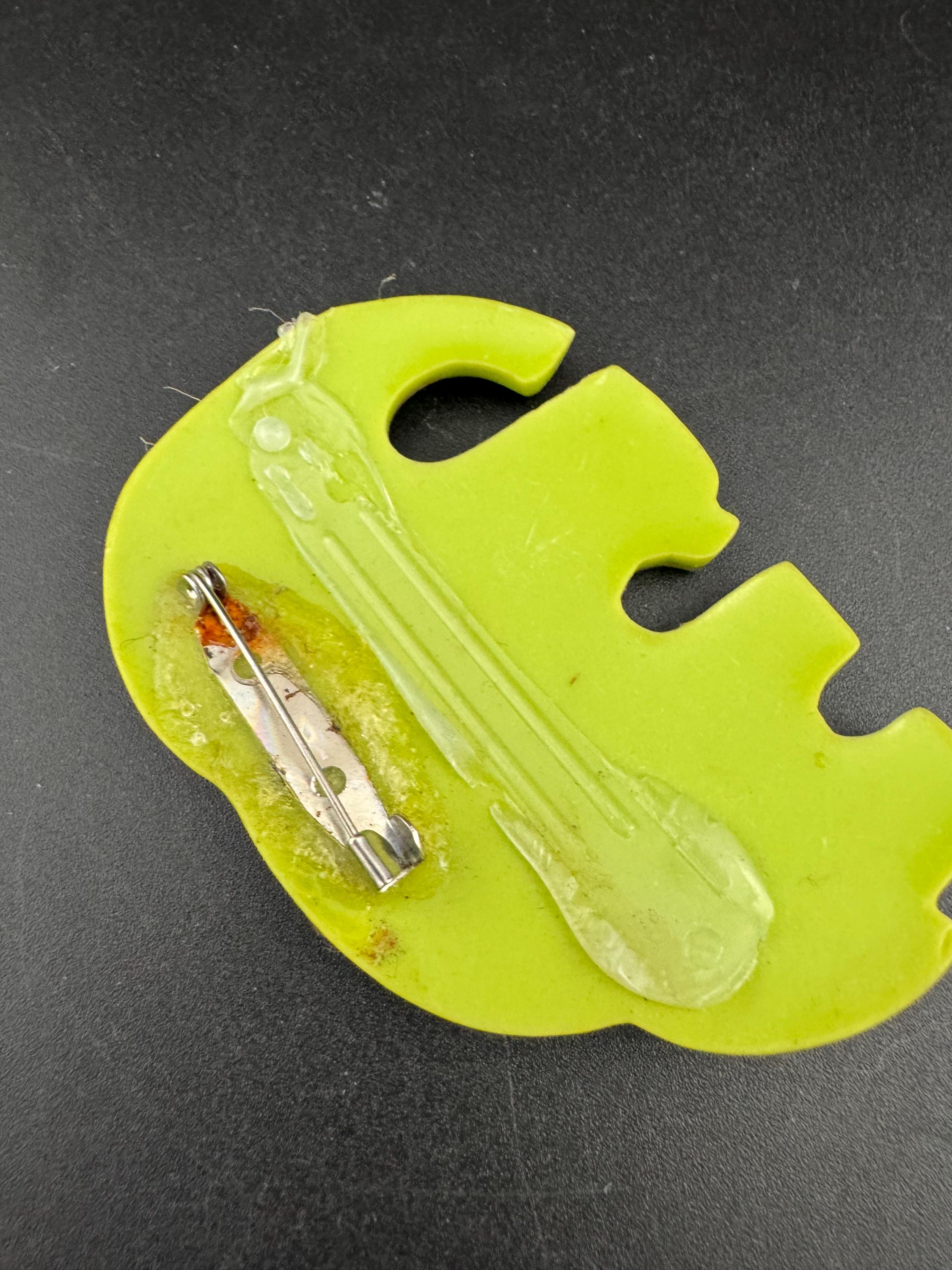 big lime green elephant and baby brooch inset with abalone shell, early plastic 1960s