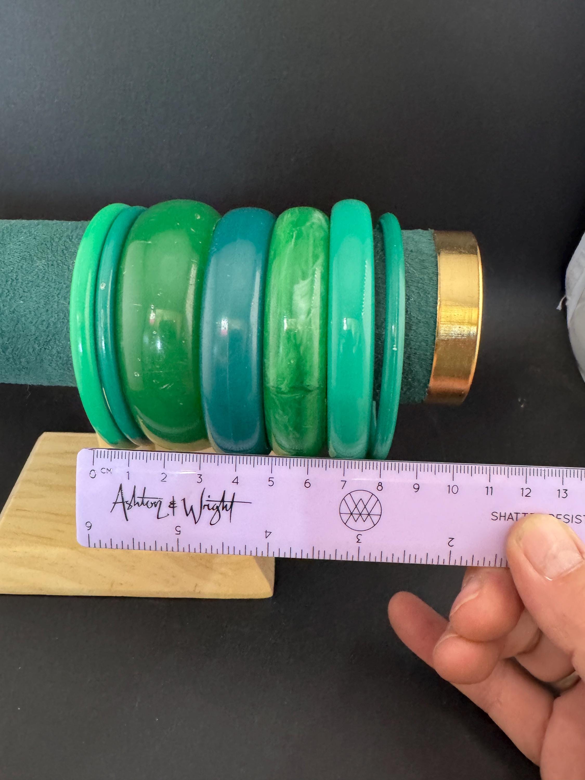 Vintage and retro curated stack of GREEN plastic acrylic bangles, bracelets