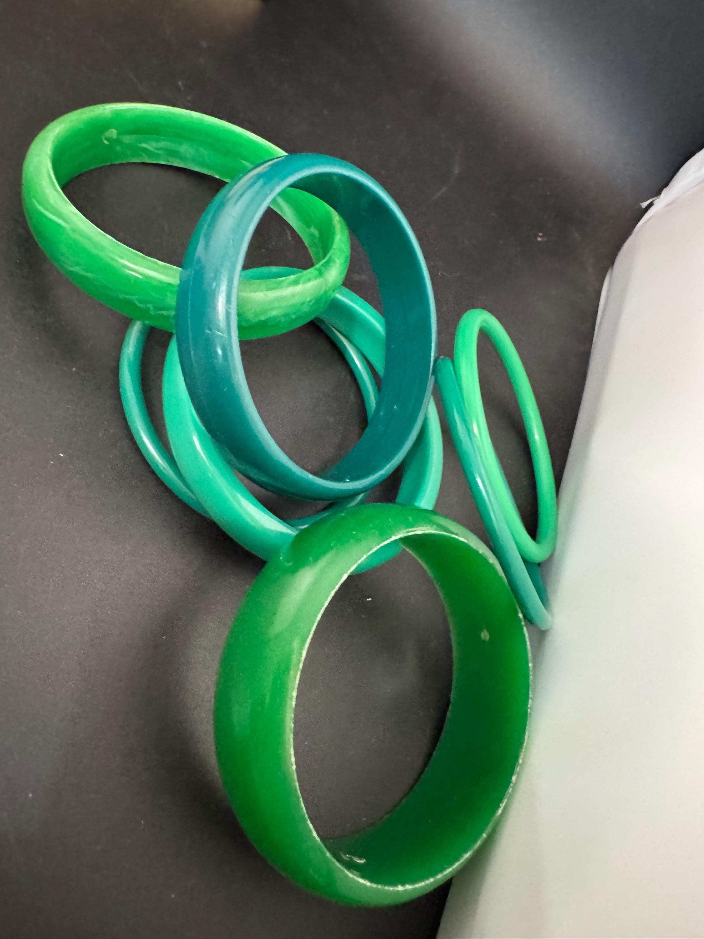 Vintage and retro curated stack of GREEN plastic acrylic bangles, bracelets