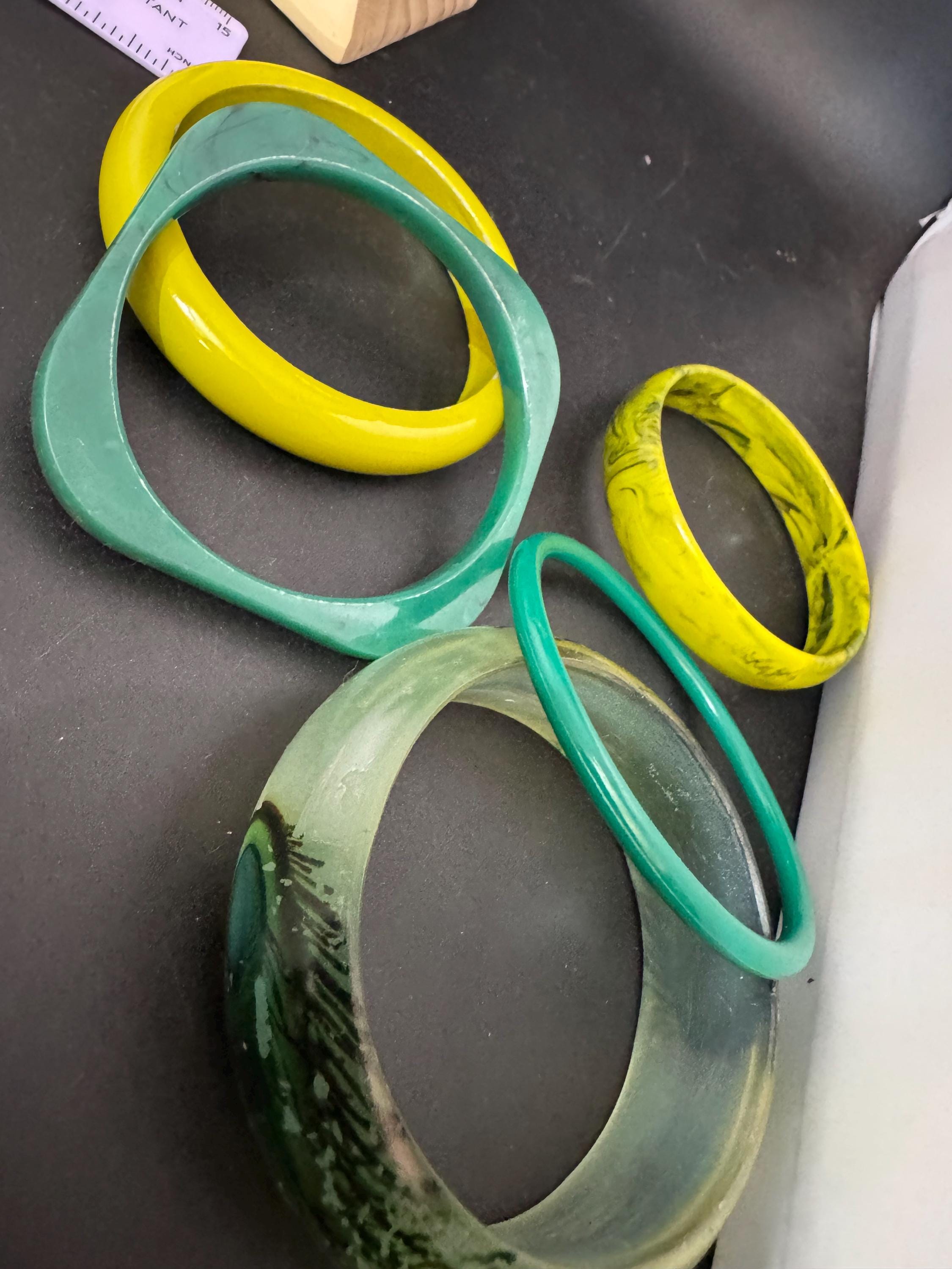 Vintage and retro curated stack of GREEN plastic acrylic bangles, bracelets
