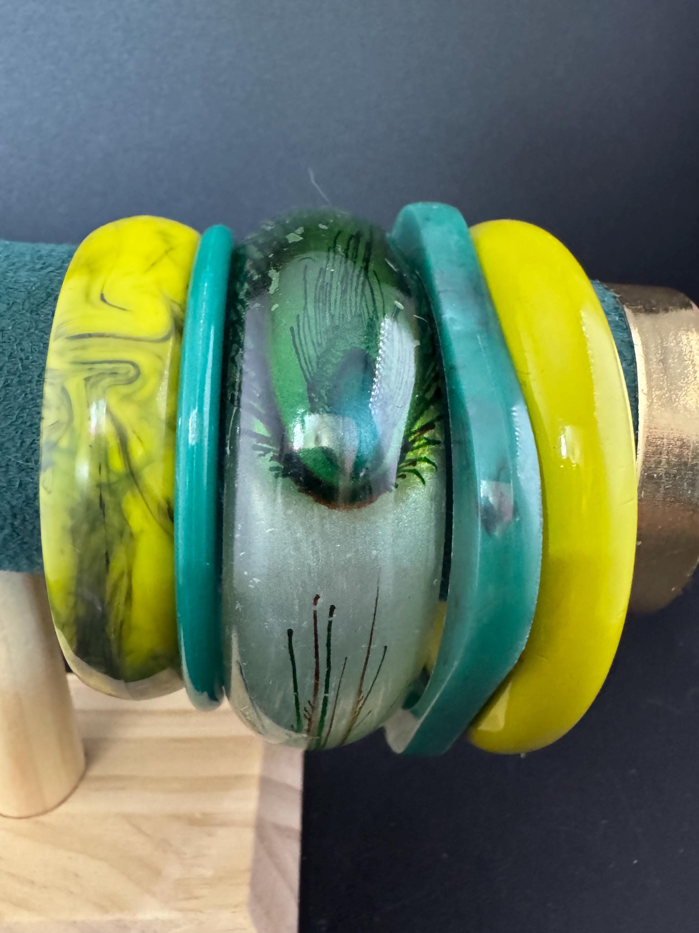 Vintage and retro curated stack of GREEN plastic acrylic bangles, bracelets