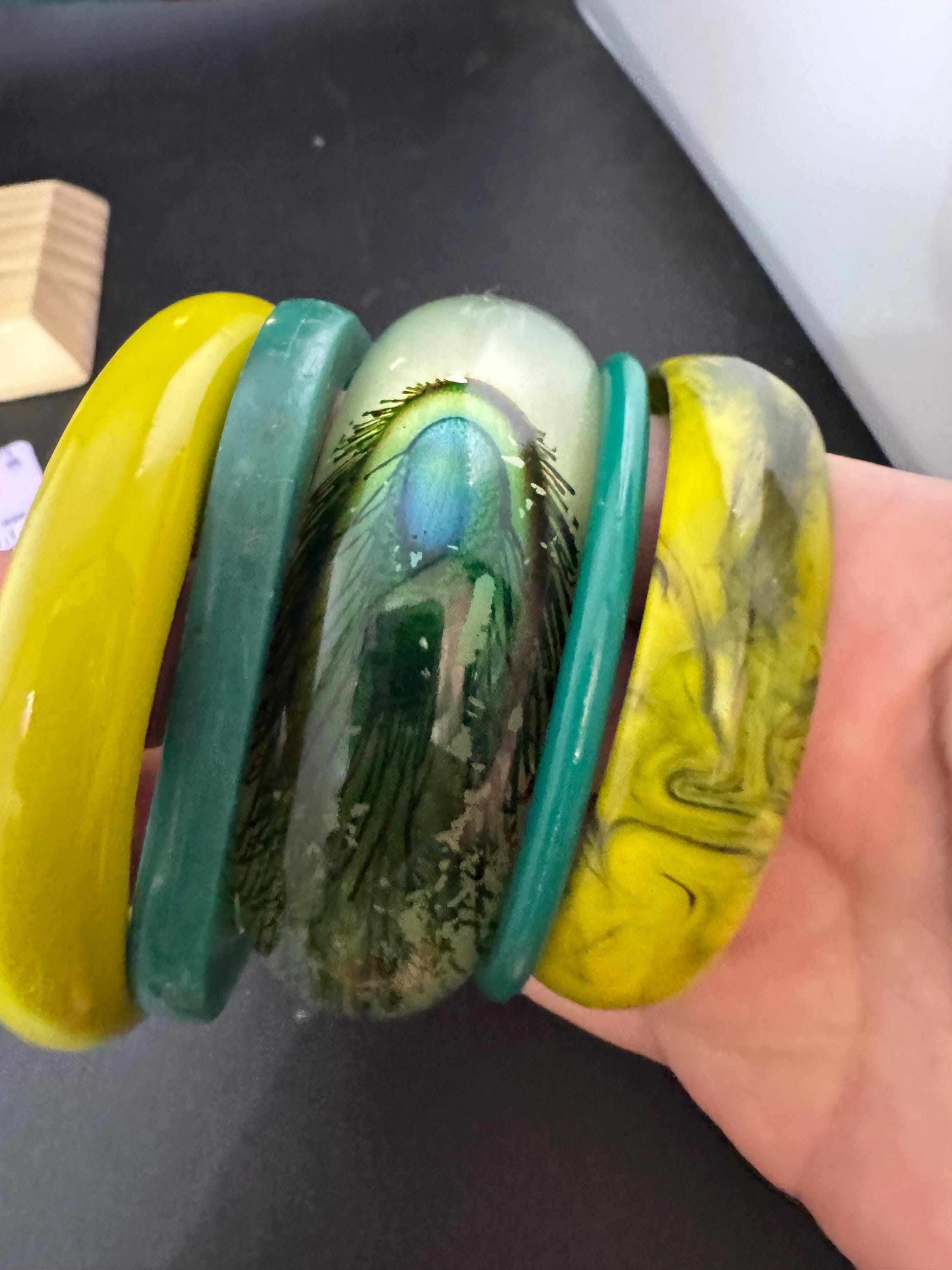Vintage and retro curated stack of GREEN plastic acrylic bangles, bracelets