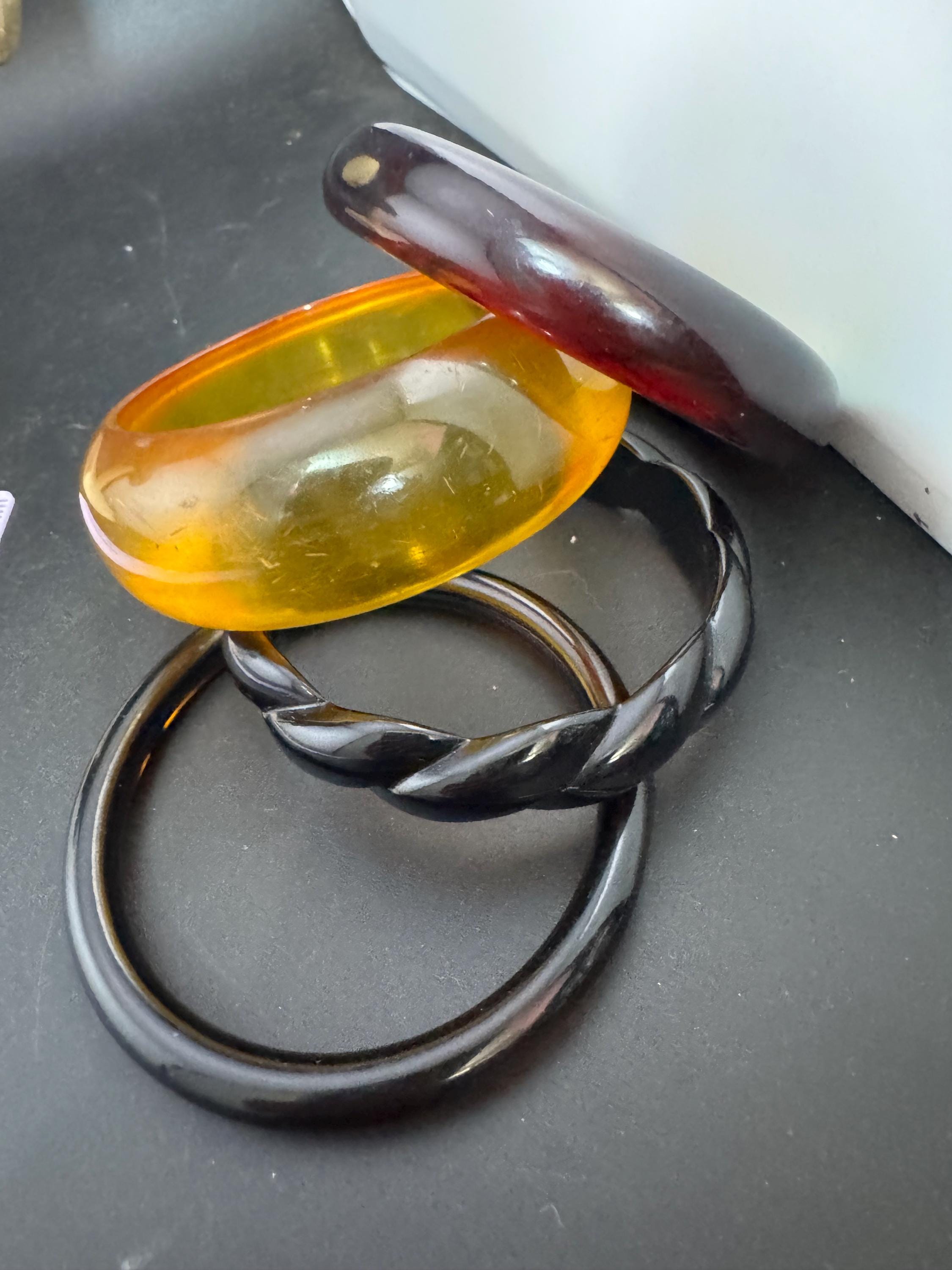 A curated stack of Faux tortoiseshell brown back Perspex plastic wide cuff bangle bracelets ideal stacking layering Vintage