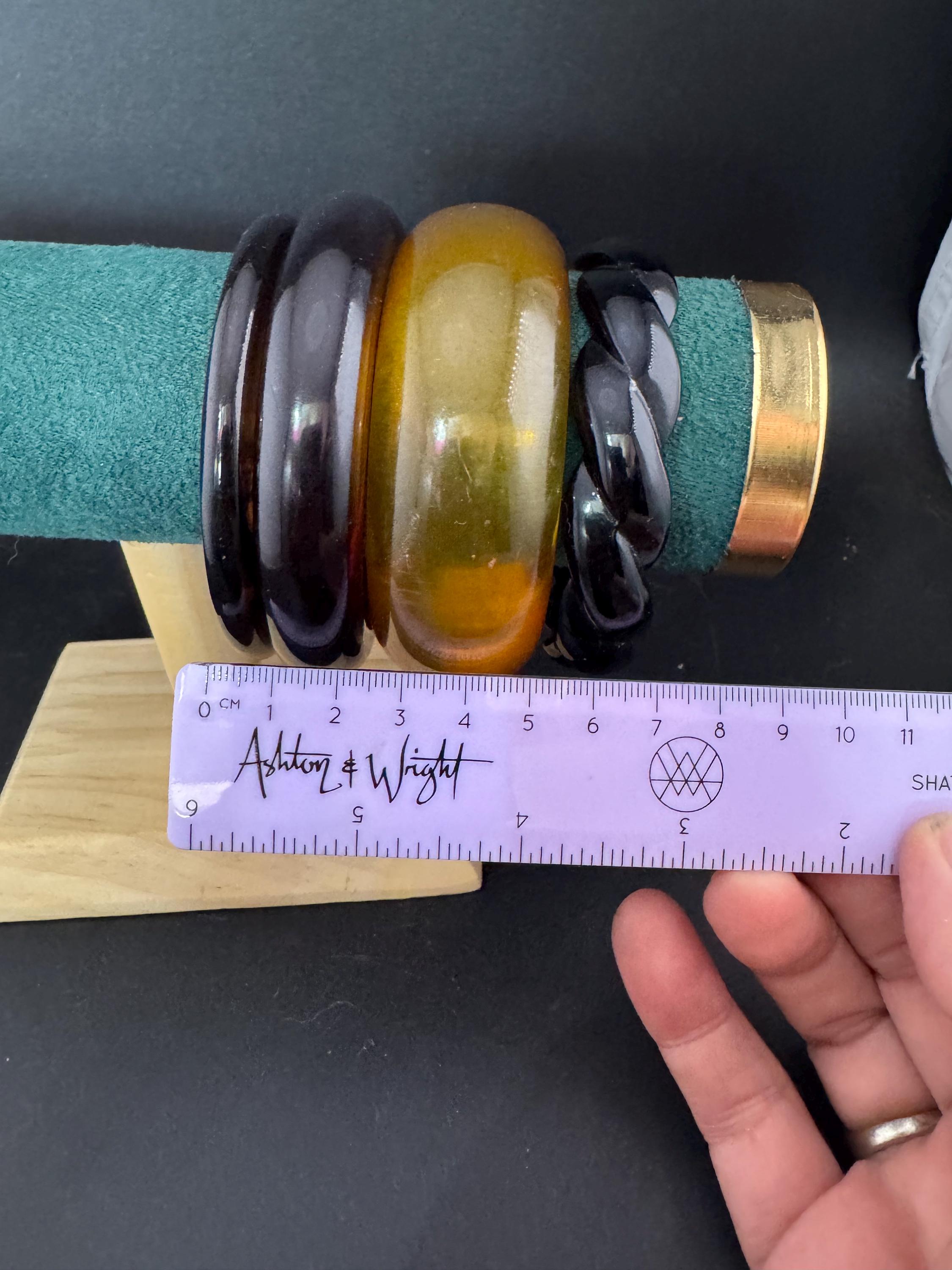 A curated stack of Faux tortoiseshell brown back Perspex plastic wide cuff bangle bracelets ideal stacking layering Vintage