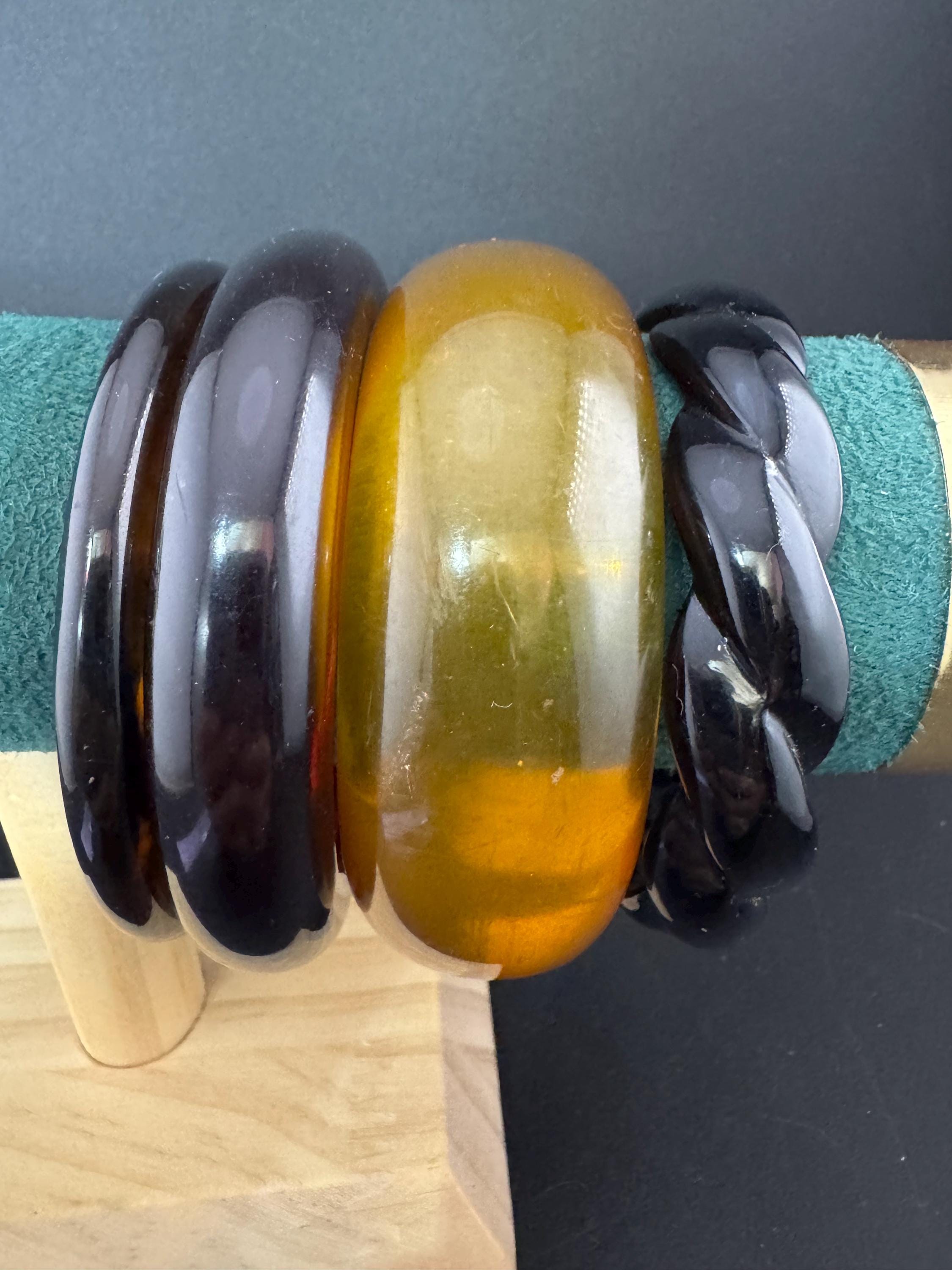 A curated stack of Faux tortoiseshell brown back Perspex plastic wide cuff bangle bracelets ideal stacking layering Vintage
