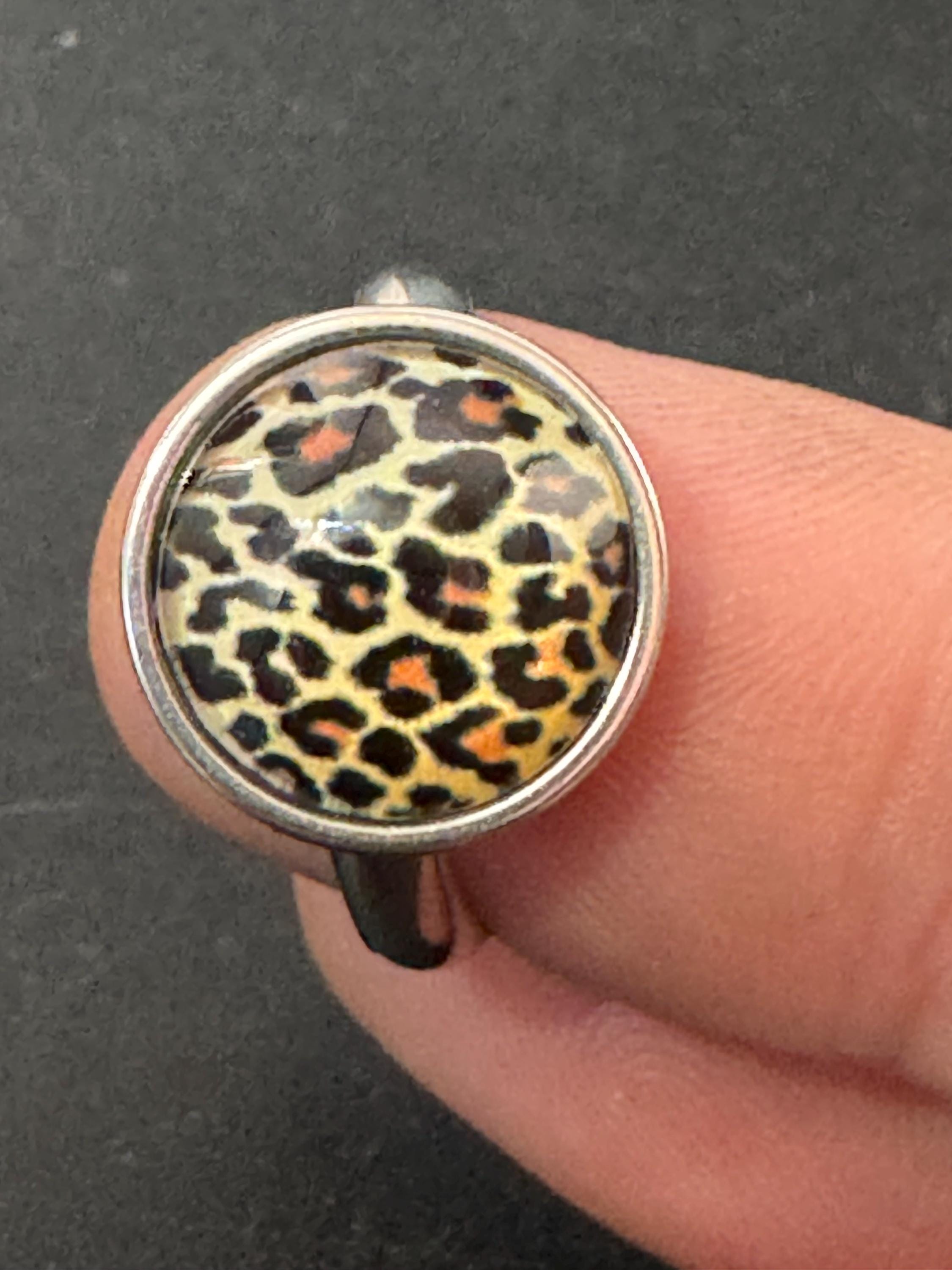 Adjustable 14mm bezel set Leopard print ring made from stainless steel, non Tarnish with a glass cabochon