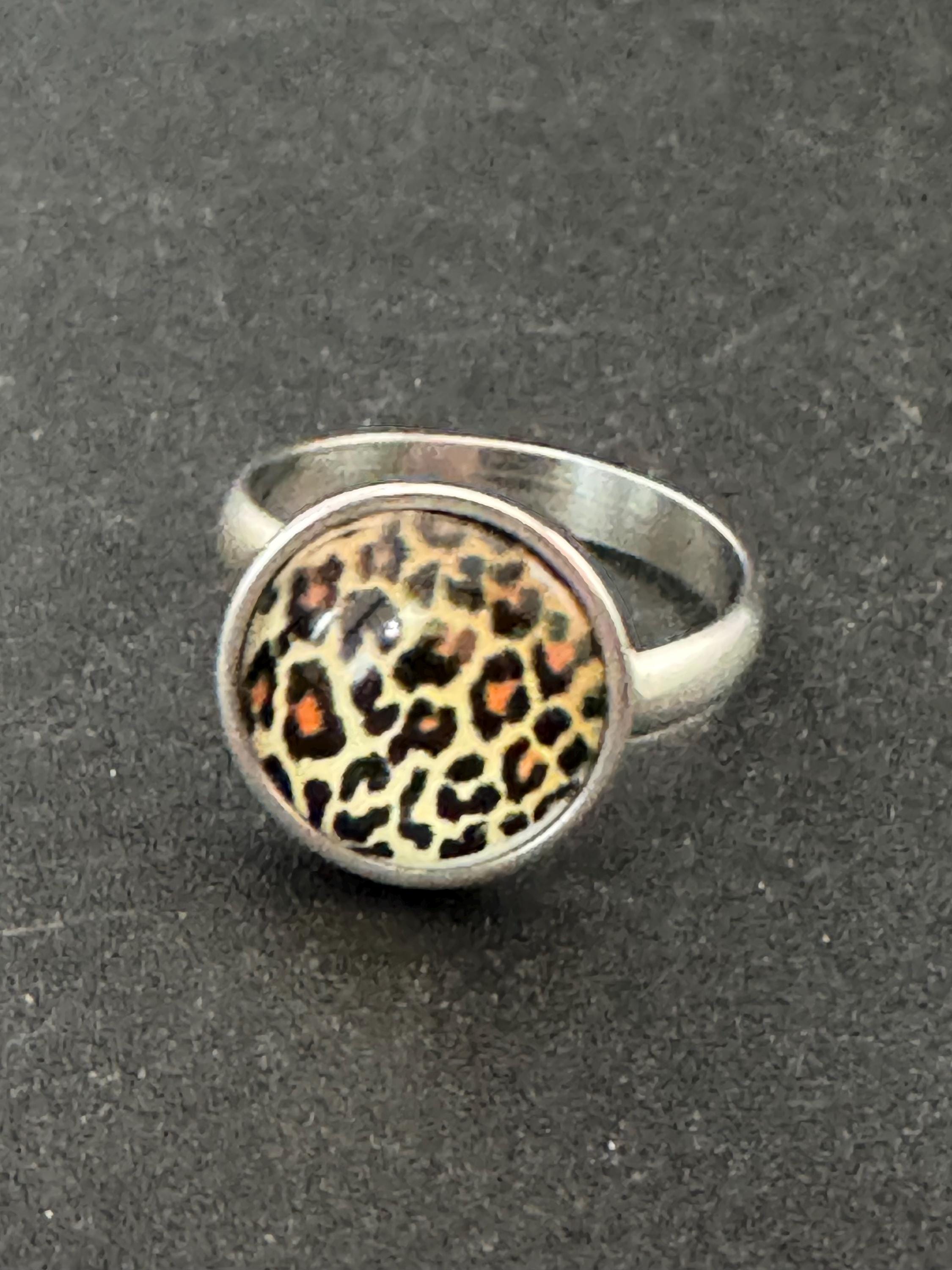 Adjustable 14mm bezel set Leopard print ring made from stainless steel, non Tarnish with a glass cabochon