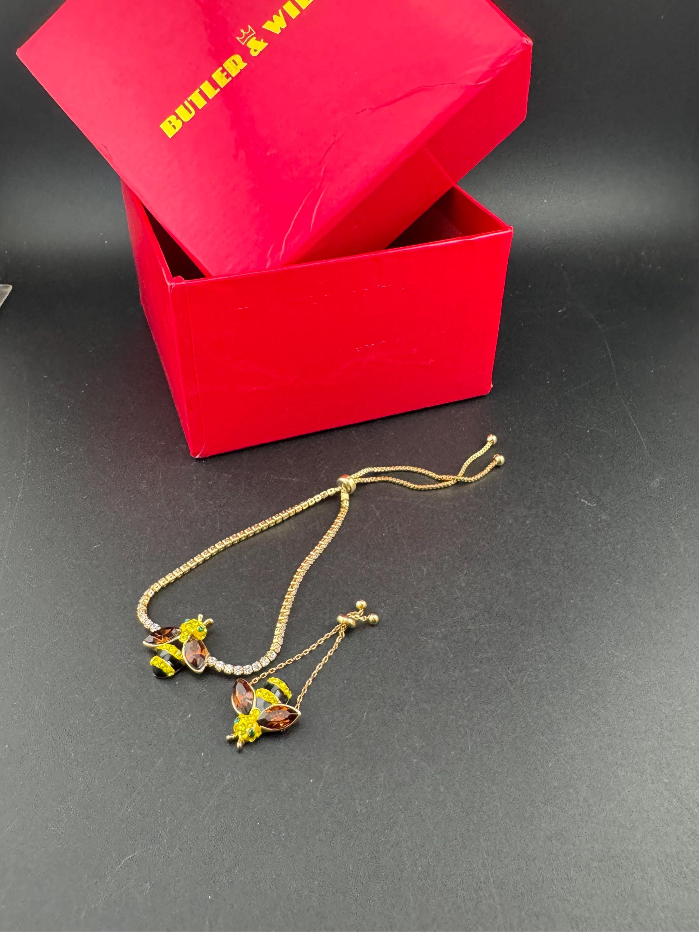 Signed butler and Wilson gold tone bumble bee jewellery set , tennis bracelet and adjustable dress ring , boxed,