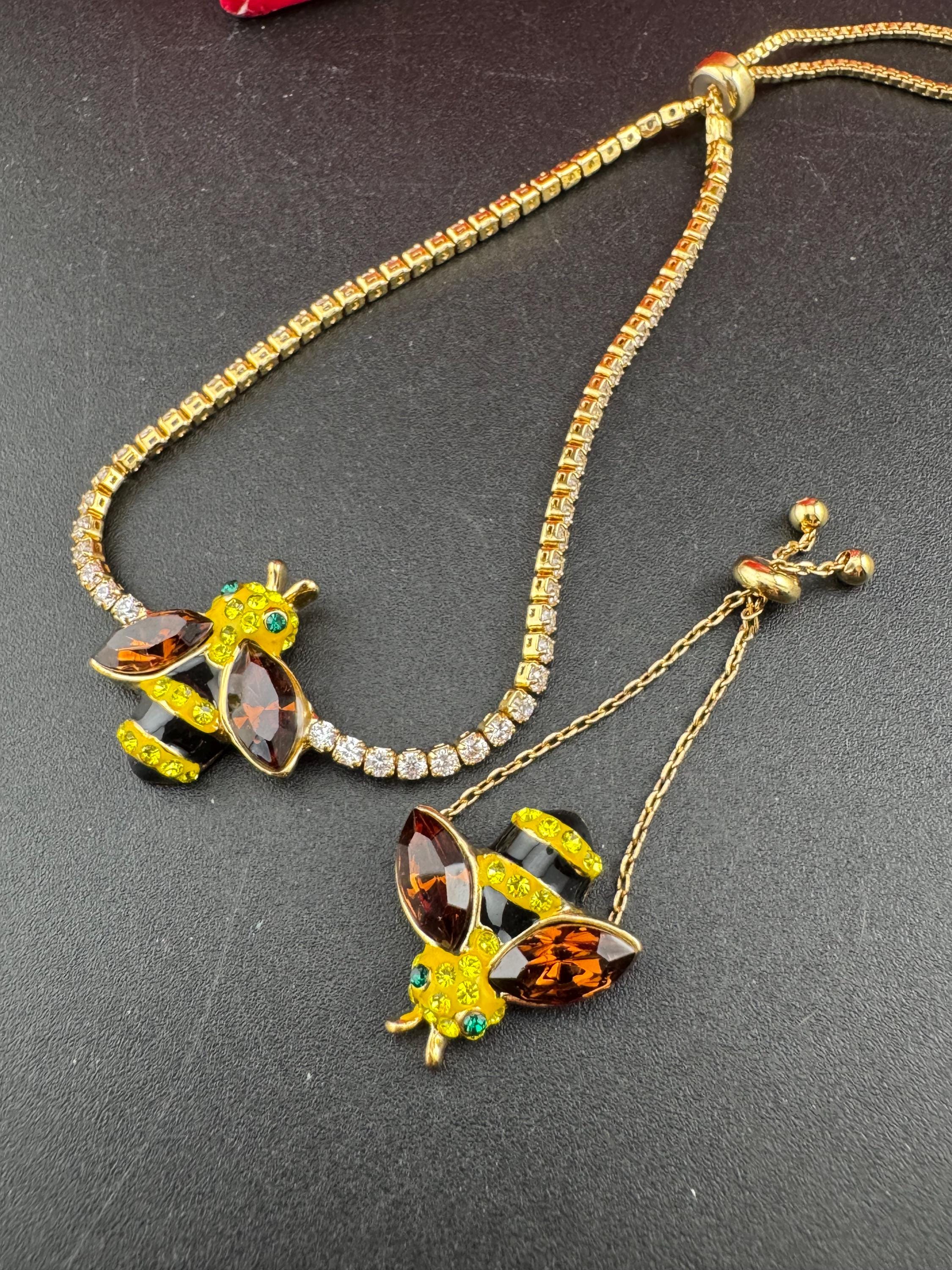 Signed butler and Wilson gold tone bumble bee jewellery set , tennis bracelet and adjustable dress ring , boxed,