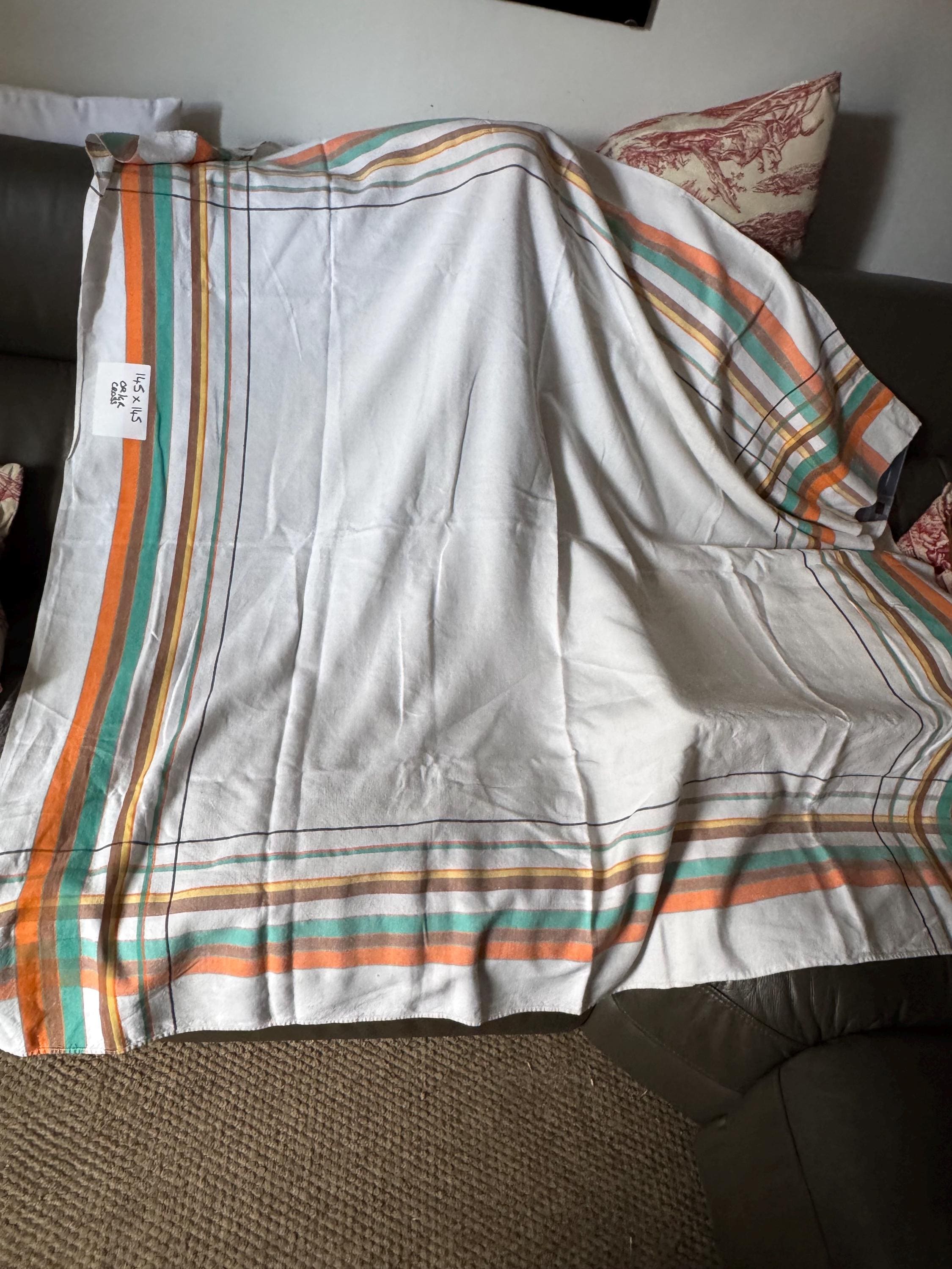Large 145cm near square off white with orange brown green and yellow geometric stripes and check large printed tablecloth
