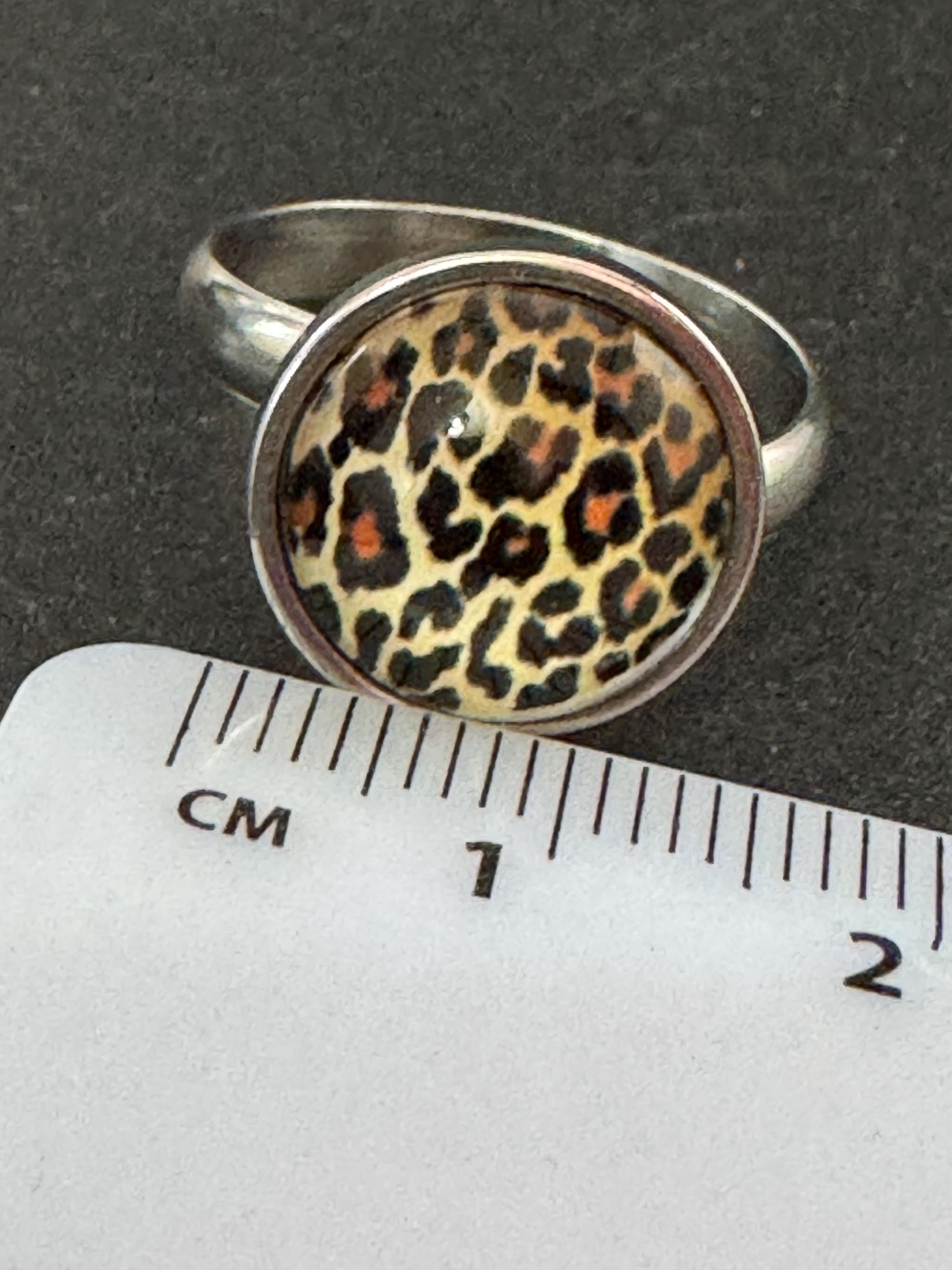 Adjustable 14mm bezel set Leopard print ring made from stainless steel, non Tarnish with a glass cabochon