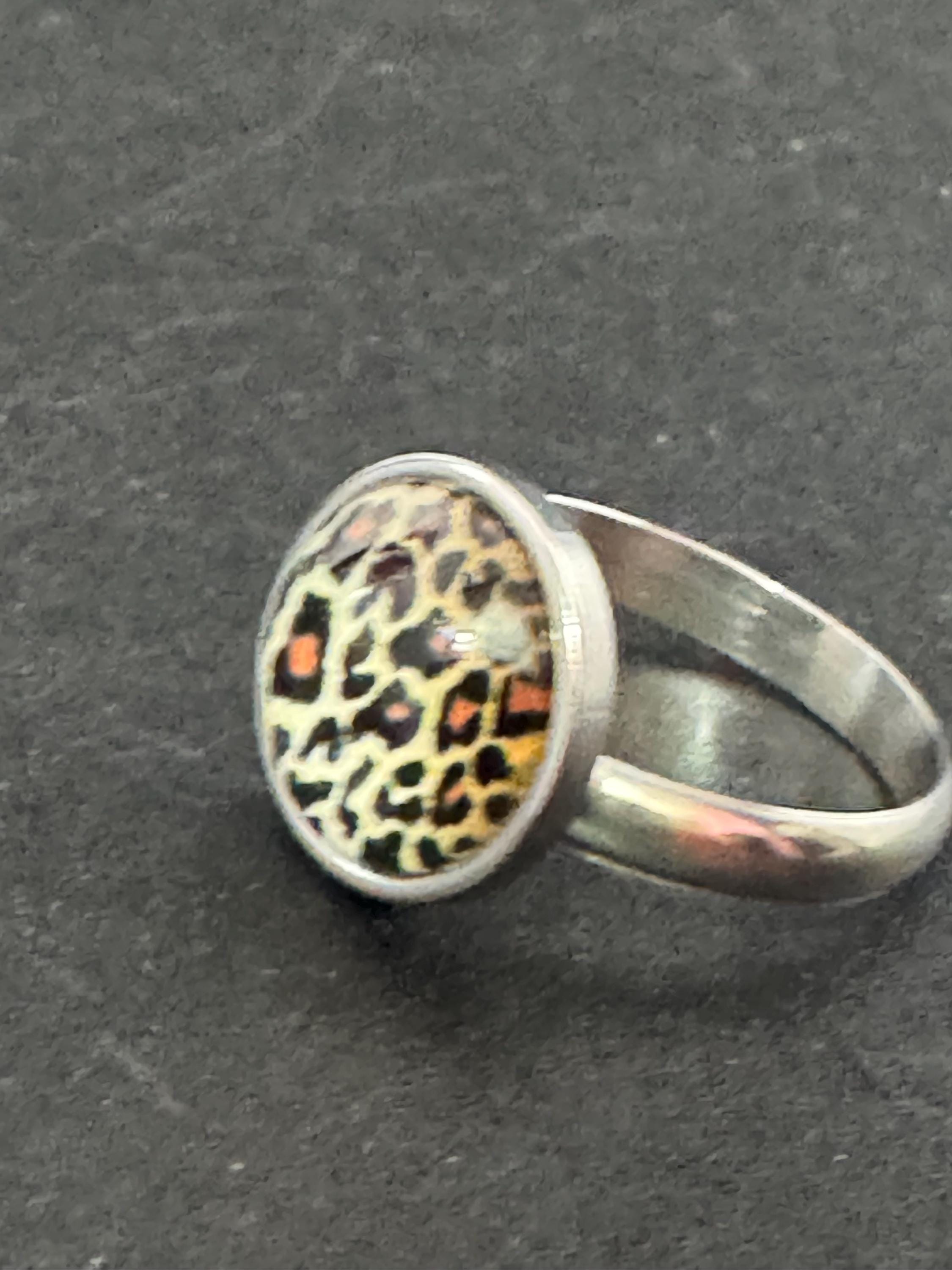 Adjustable 14mm bezel set Leopard print ring made from stainless steel, non Tarnish with a glass cabochon