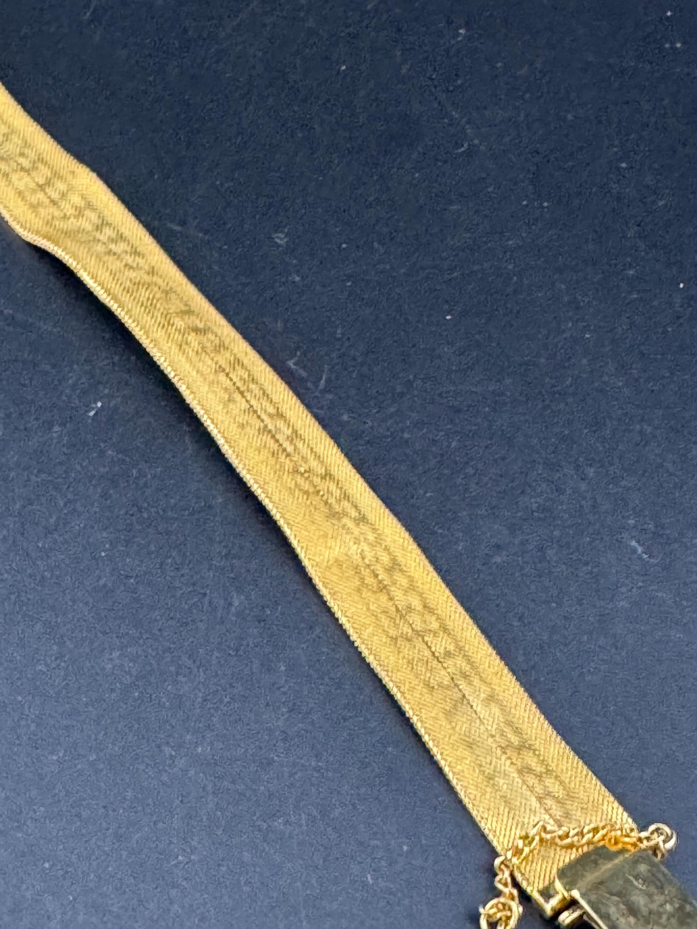 1970s geometric design bright gold plated articulated flat wide mesh bracelet with safety chain